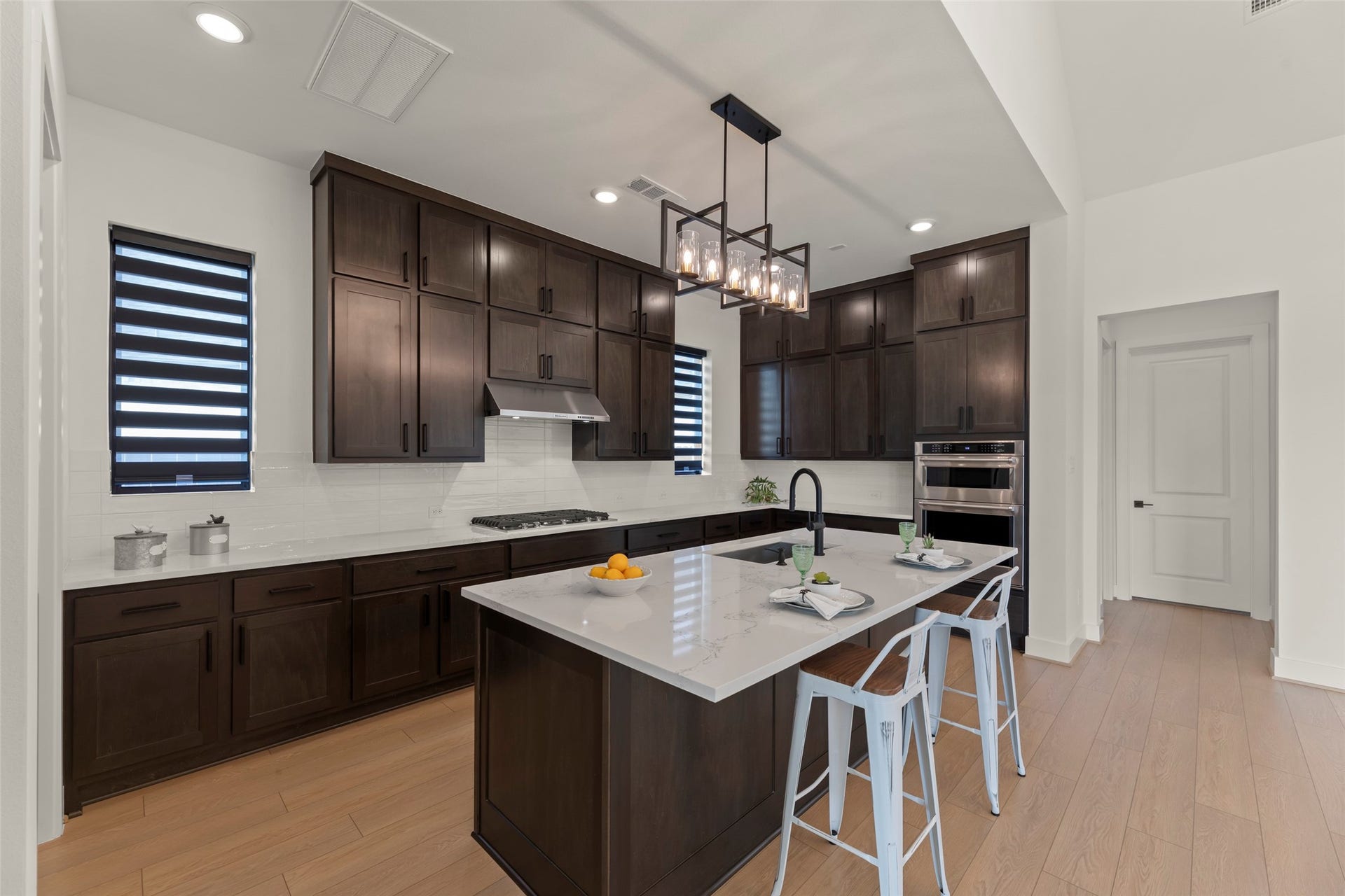 2015 Jade Manor Drive, Rosenberg, TX 77469 Large island with seating, and modern pendant lighting.