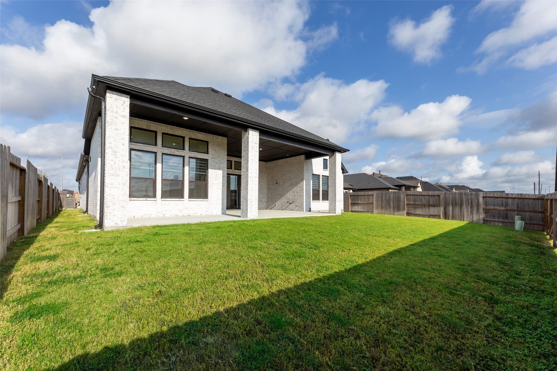 2015 Jade Manor Drive, Rosenberg, TX 77469 Covered patio, and modern exterior, perfect for outdoor enjoyment and entertaining.