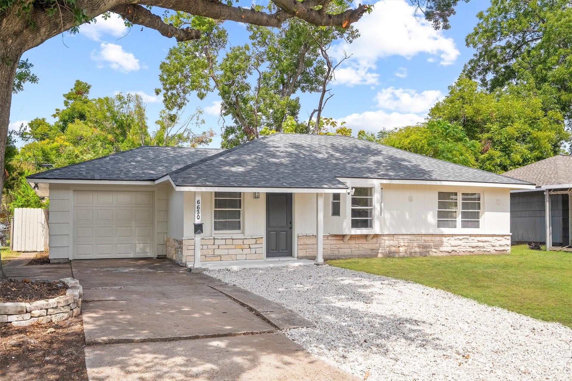 6630 Maybank Drive, Houston, TX 77055 Nice single-story home with a modern roof and fresh exterior, featuring a cozy front porch and a spacious attached garage, nestled in a lush, tree-lined neighborhood.