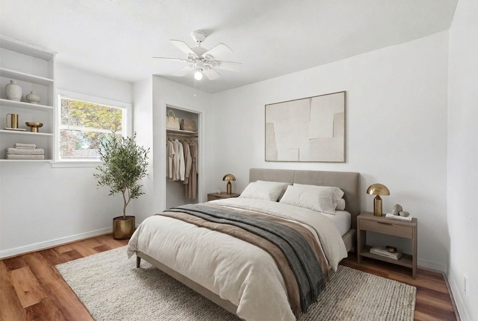 6630 Maybank Drive, Houston, TX 77055 Experience serene comfort in this bedroom, featuring elegant built-in shelving, warm wood flooring, and abundant natural light for a peaceful retreat. (Virtual Staging)