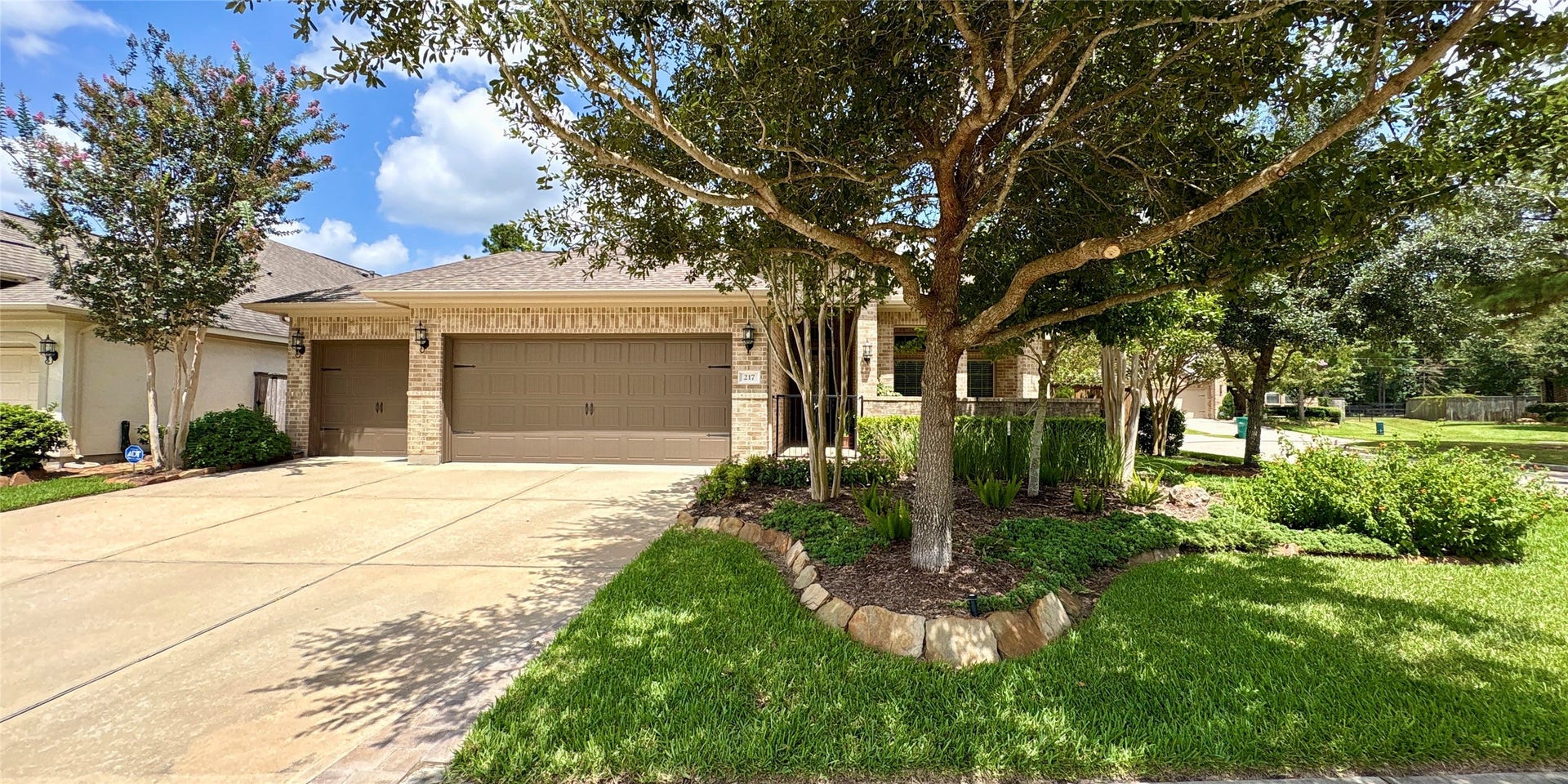 Charming one-story brick home with well-manicured landscaping, mature trees, and a welcoming front entrance. Set on a corner lot with a spacious front lawn, it offers excellent curb appeal in a quiet neighborhood.        
Three-car garage