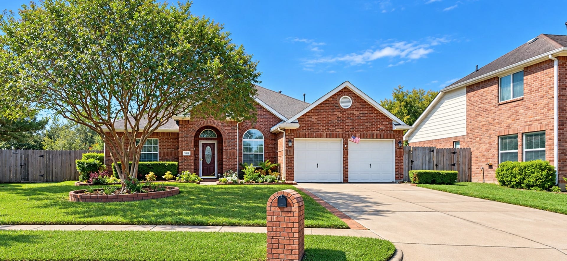 3511 Harbor Pass Lane, Friendswood, TX 77546 Charming brick home with a welcoming front yard, mature tree, and spacious driveway, perfectly embodying "Home Sweet Home.