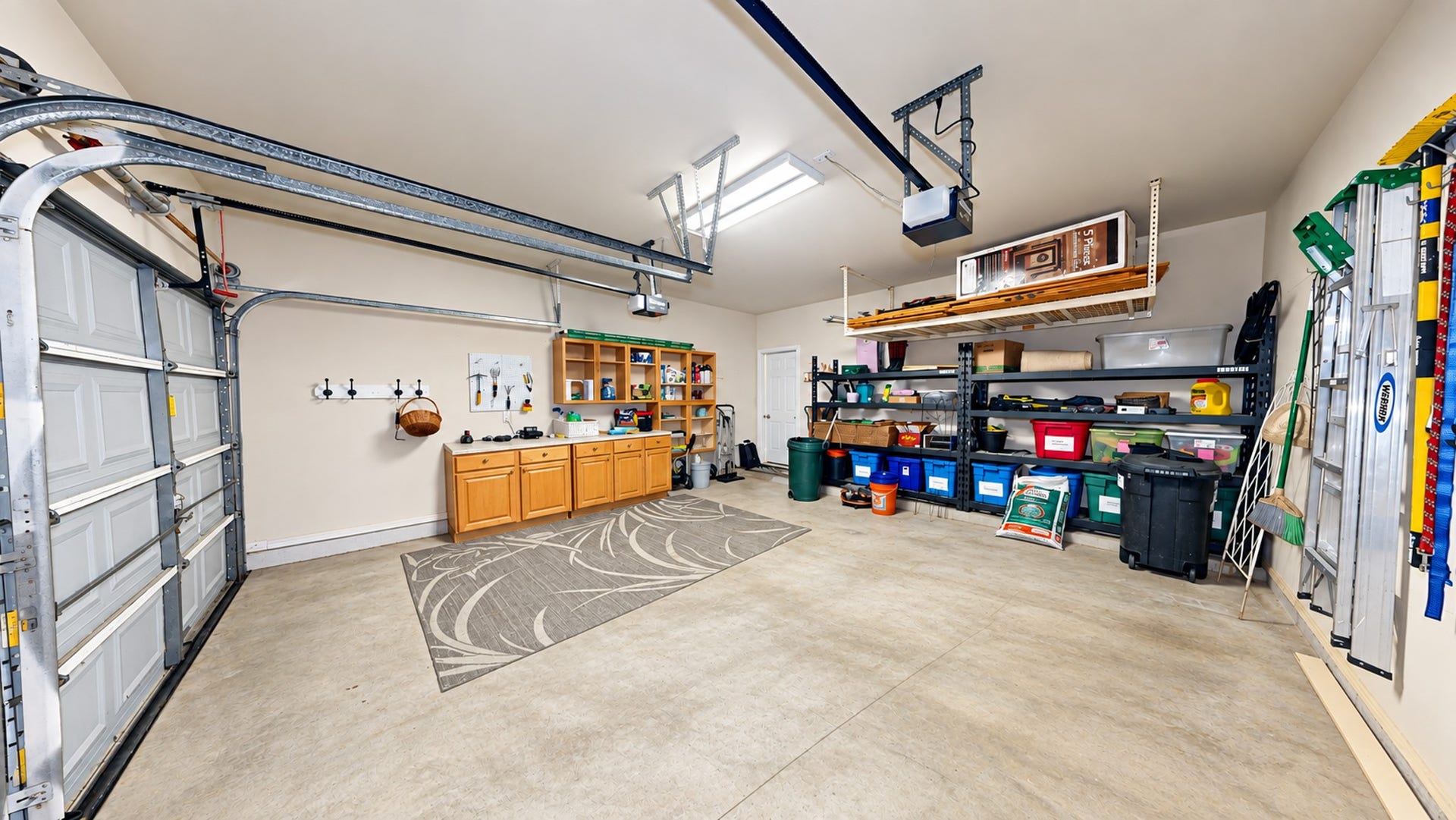 3511 Harbor Pass Lane, Friendswood, TX 77546 Garage has 2-garage door openers. Extra storage overhead.