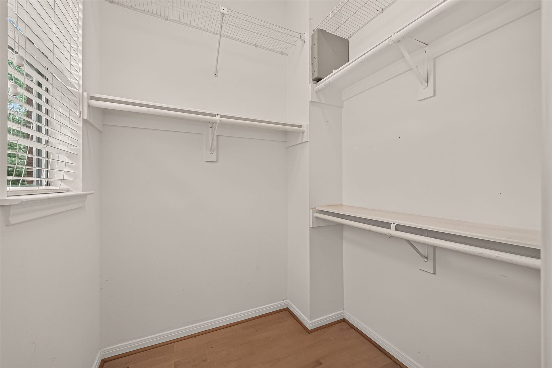 2903 Austin Street, Houston, TX 77004 One of two closets in the primary bedroom, featuring a window that brings in natural light and adds a unique touch to the space.