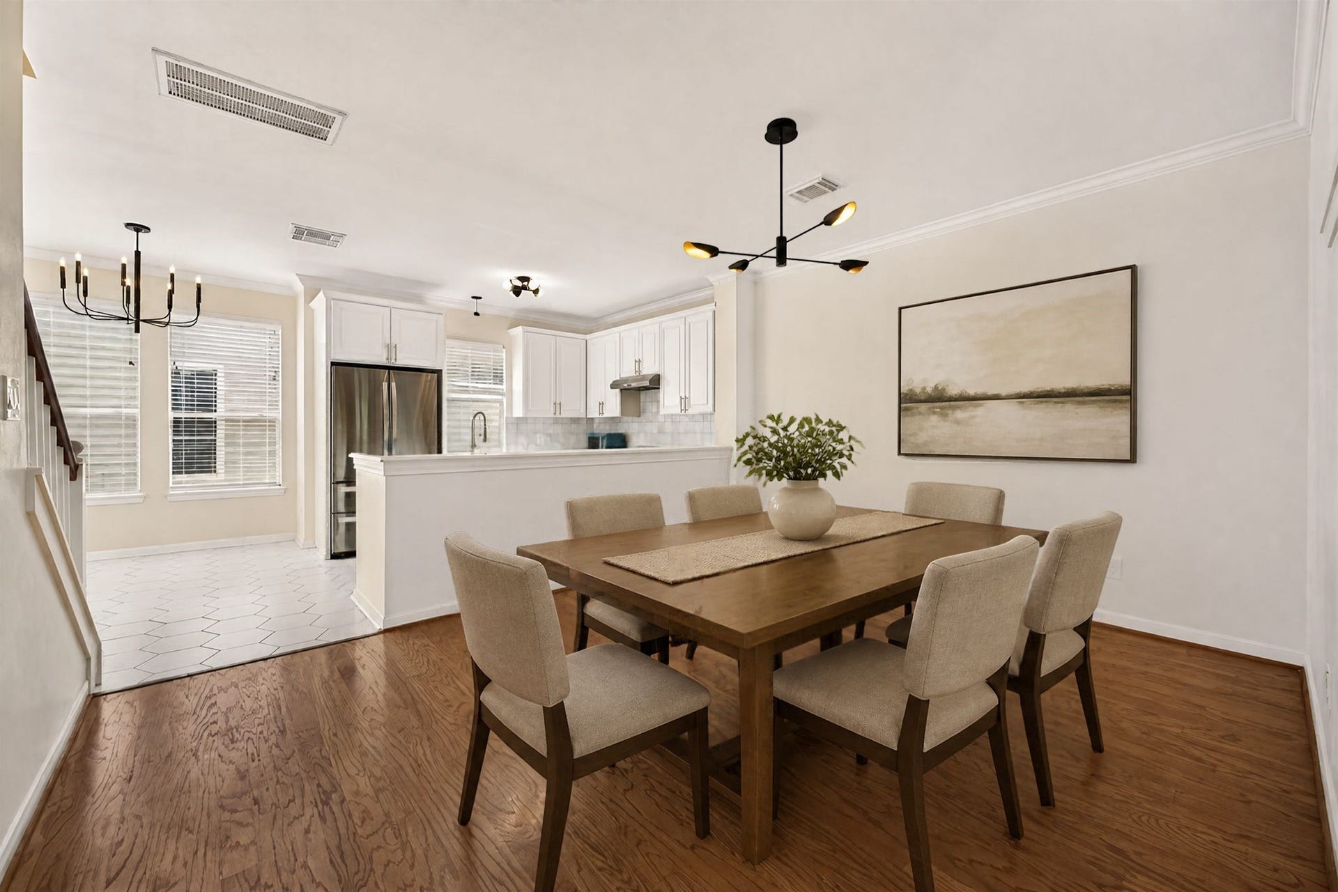 2903 Austin Street, Houston, TX 77004 Virtually staged Dining room, fresh paint with a new modern light fixture.