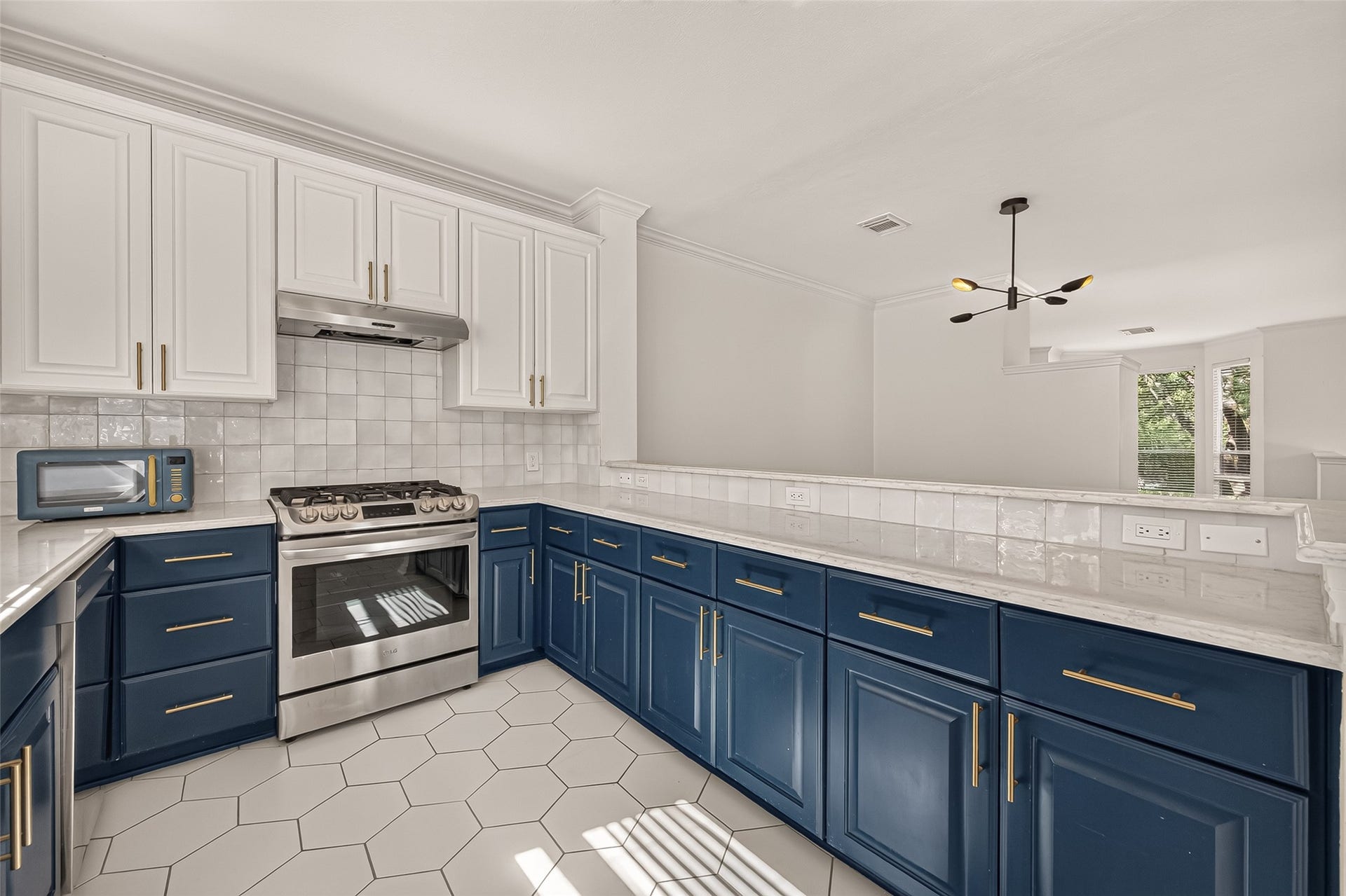 2903 Austin Street, Houston, TX 77004 Beautifully updated kitchen with a modern, thoughtfully designed layout, plenty of counter space, ample cabinetry, and a sunny window over the sink.