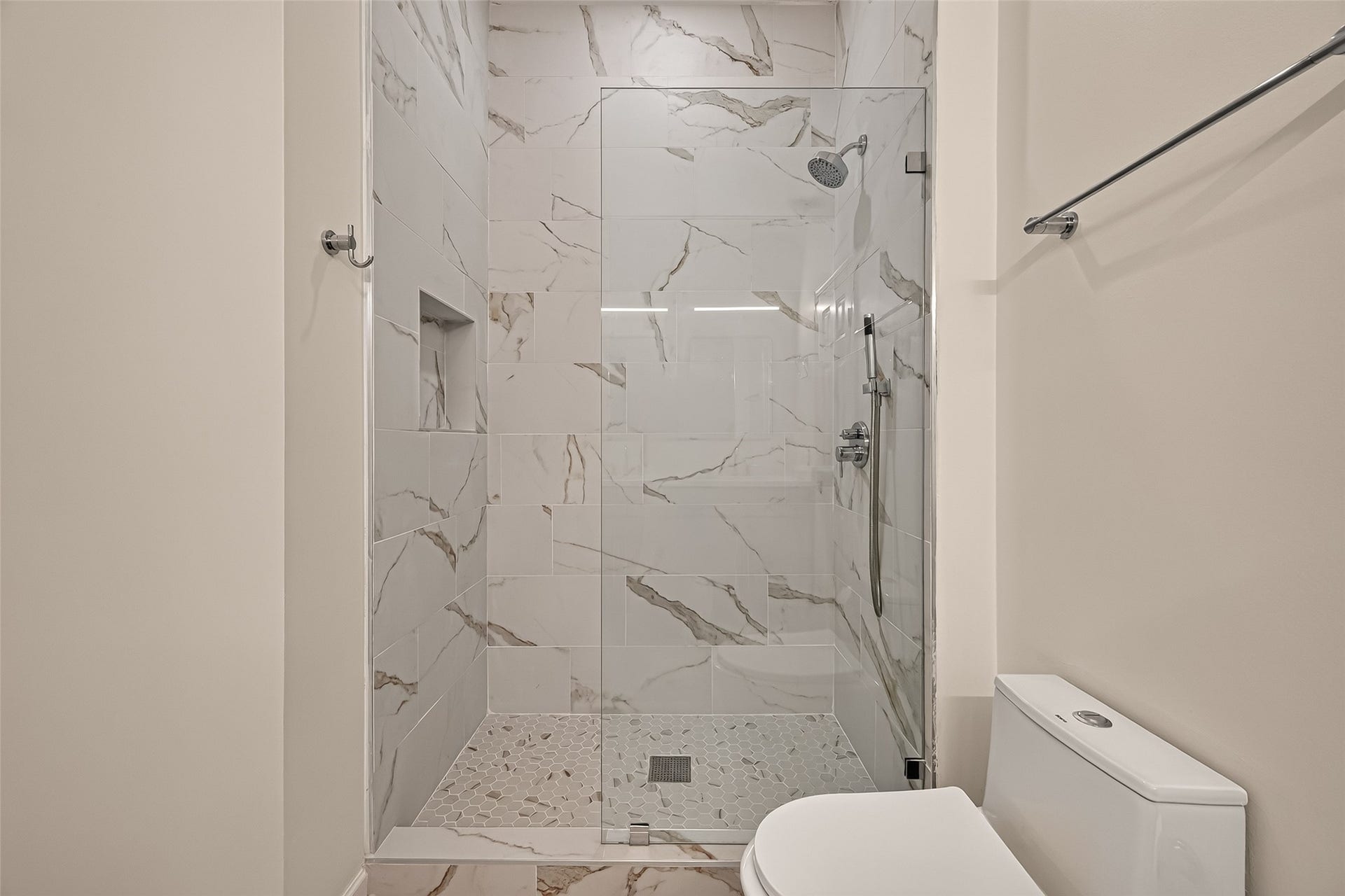 2903 Austin Street, Houston, TX 77004 Beautifully designed walk-in shower featuring dual showerheads for a refreshing, spa-like experience.