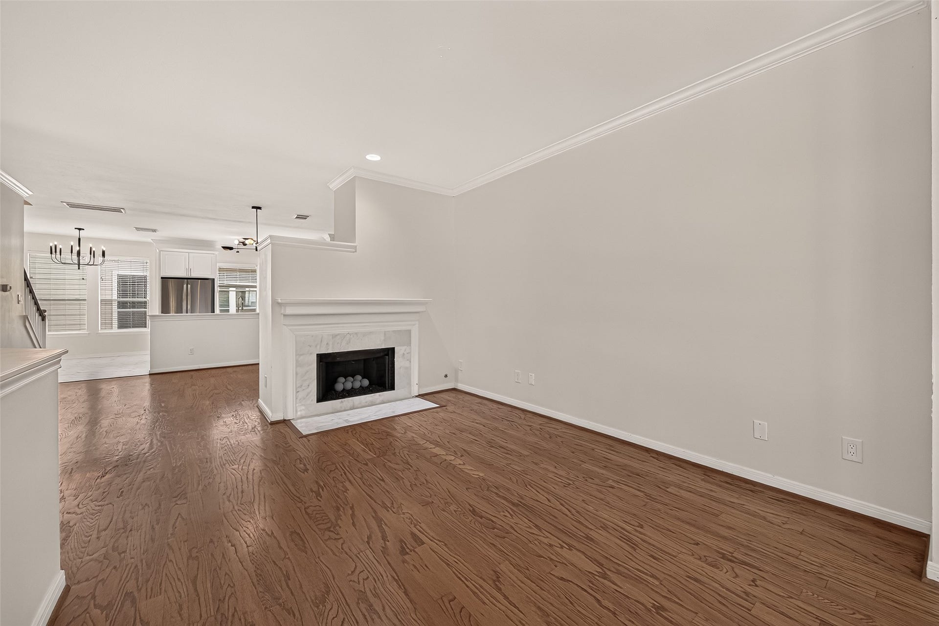 2903 Austin Street, Houston, TX 77004 The fireplace serves as the focal point of the living room, adding a fresh, modern touch while bringing the surrounding spaces together.