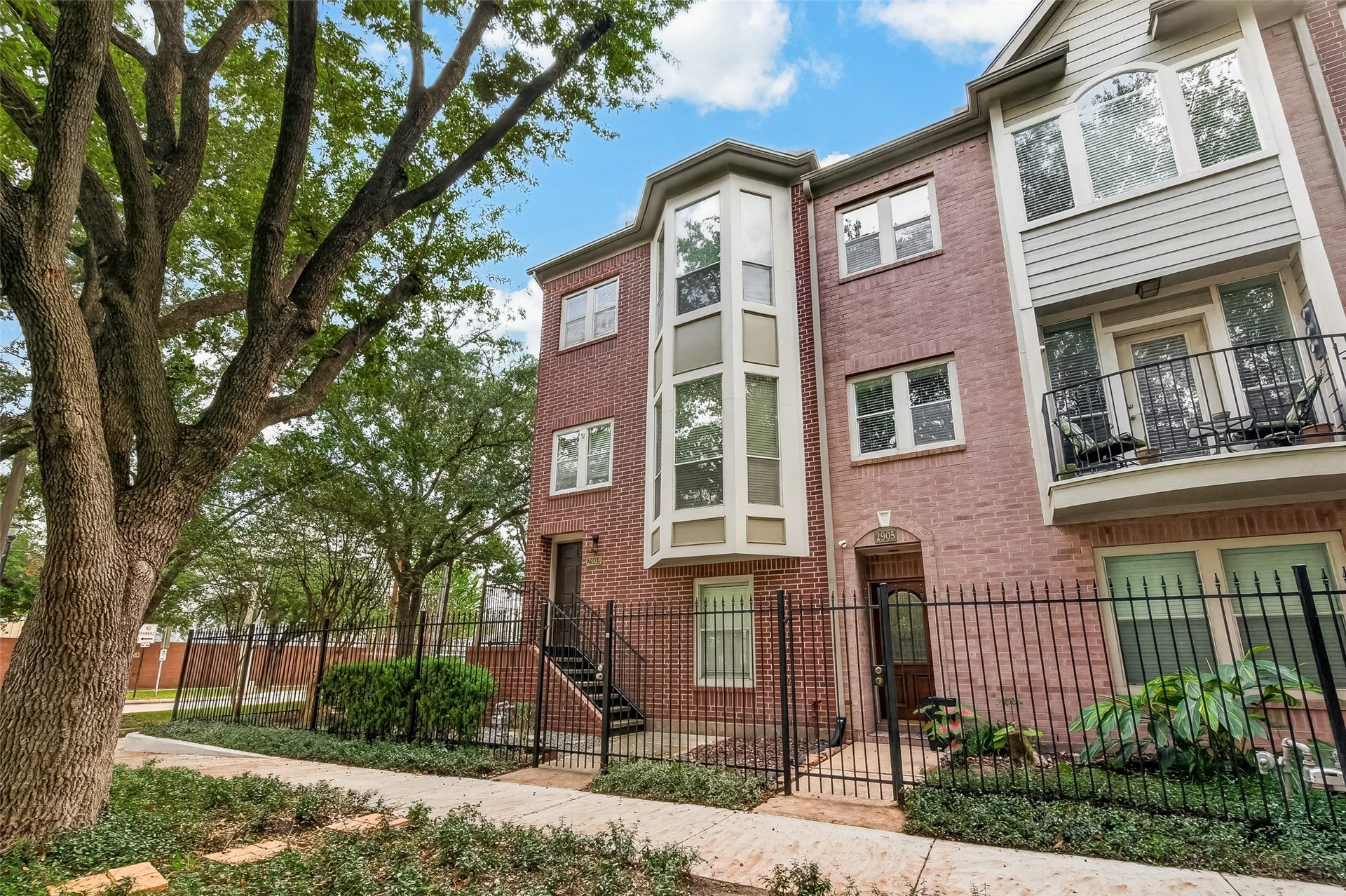 2903 Austin Street, Houston, TX 77004 Enjoy the best of city living with nearby restaurants, shopping, bike paths, and green spaces. This corner-unit townhome offers a gated yard, mature trees, and an attached two-car garage, giving you a welcoming place to call home while staying close to everything Midtown has to offer.