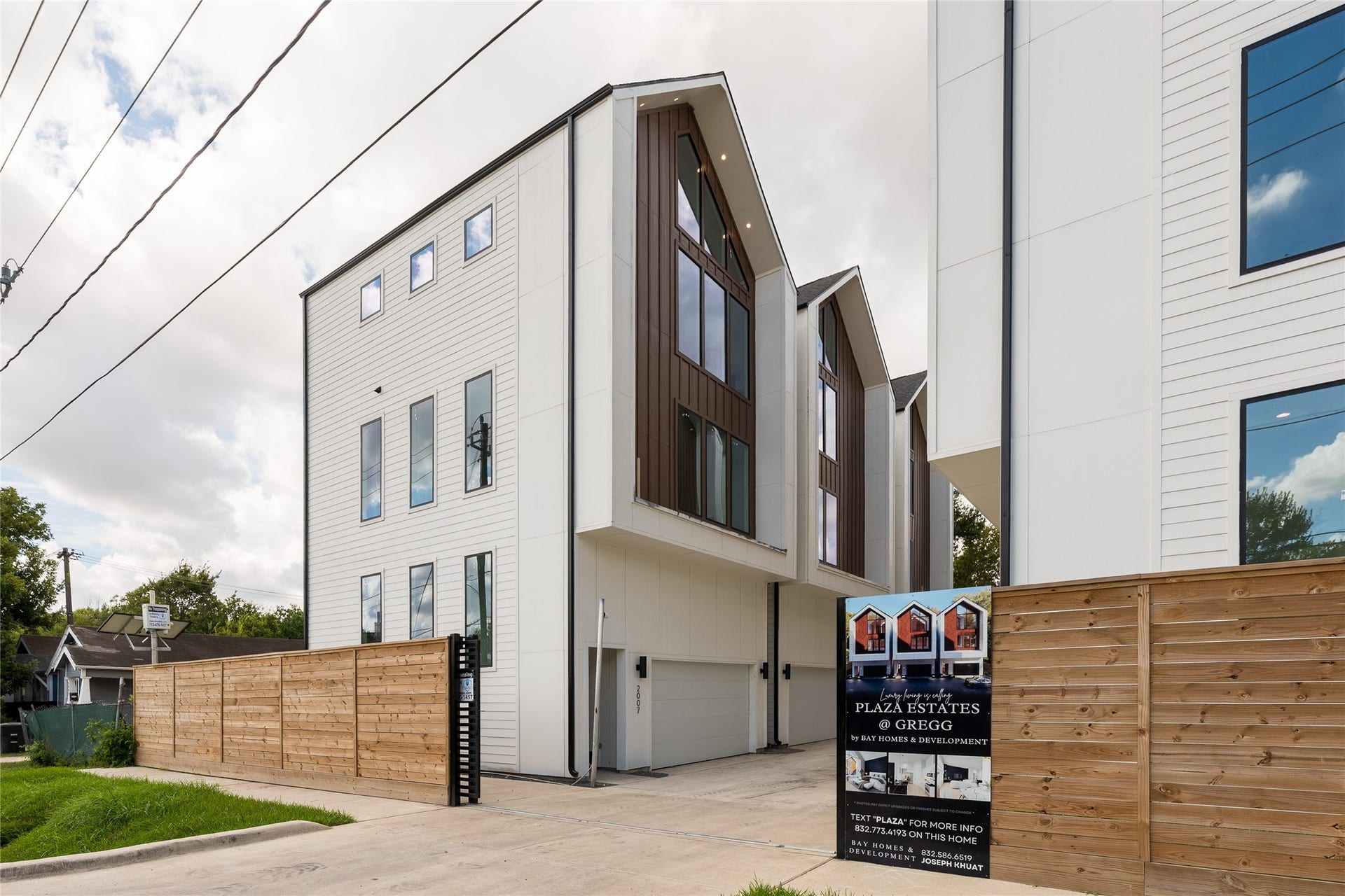 2009 Gregg Street, Houston, TX 77026 Modern home with sleek design, large windows, and a private garage, nestled in a gated community.