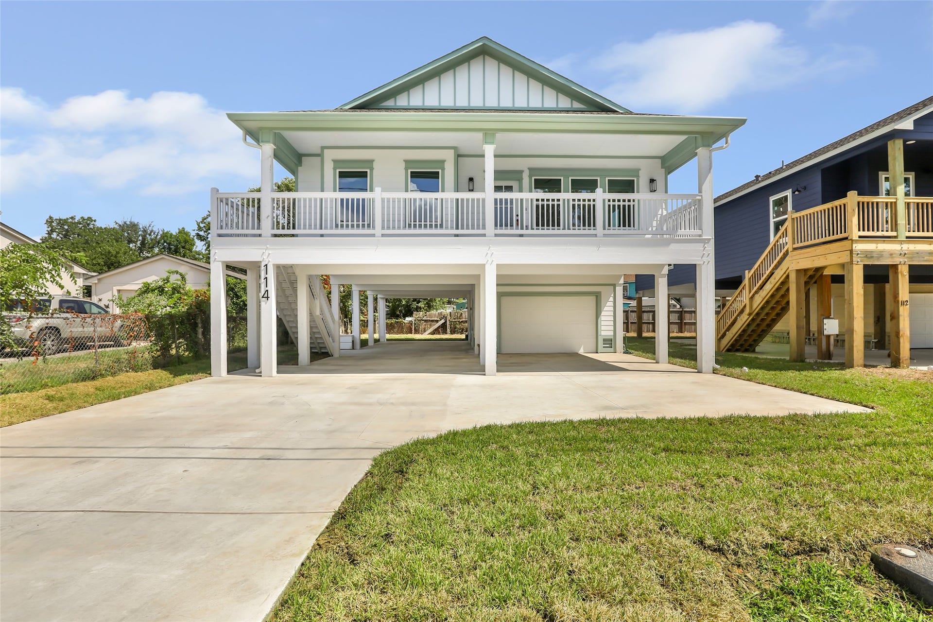 Charming elevated home with a spacious balcony, offering 4 bedrooms and 2 baths, perfect for comfortable bay living.