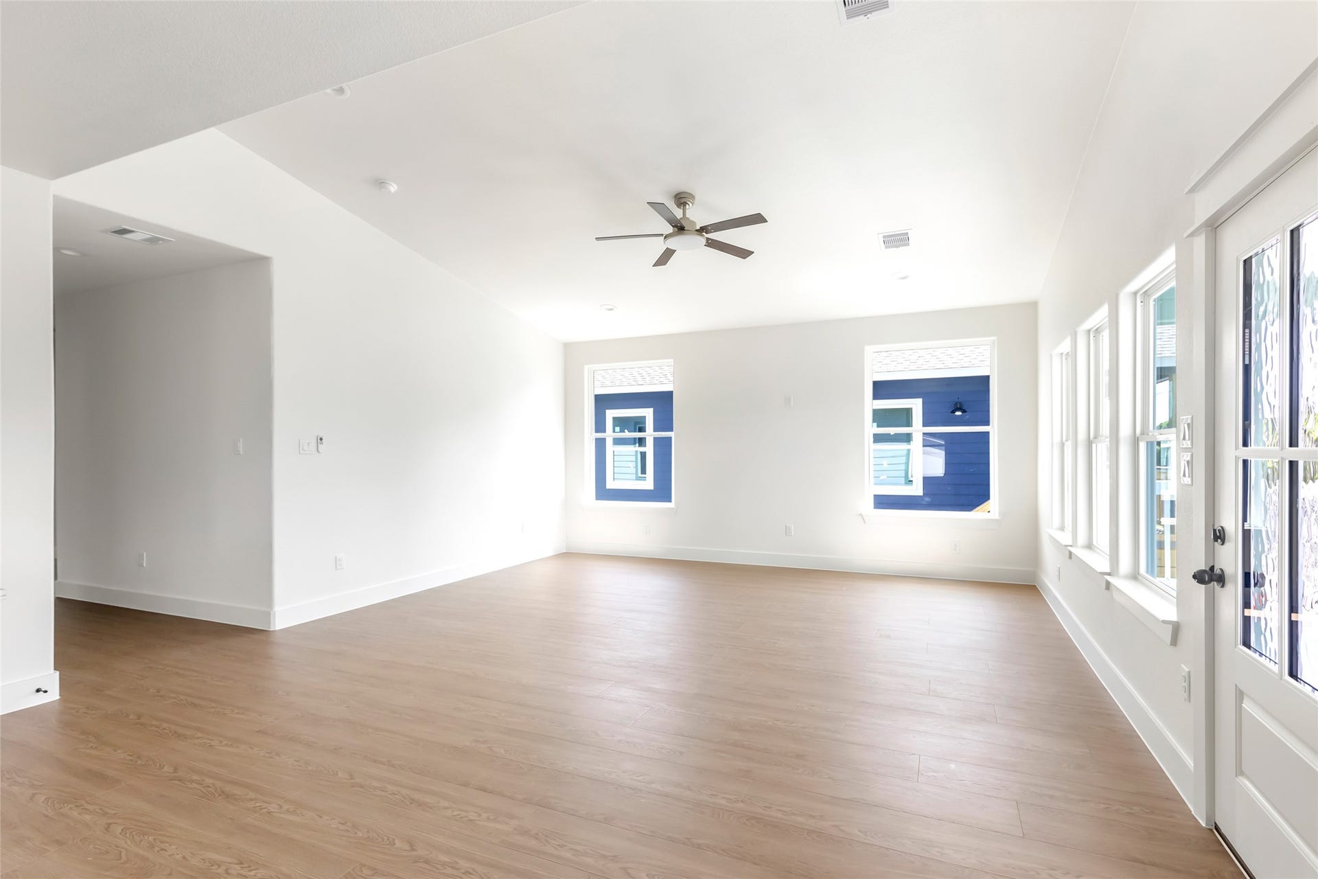 Vaulted living area with abundant natural light.