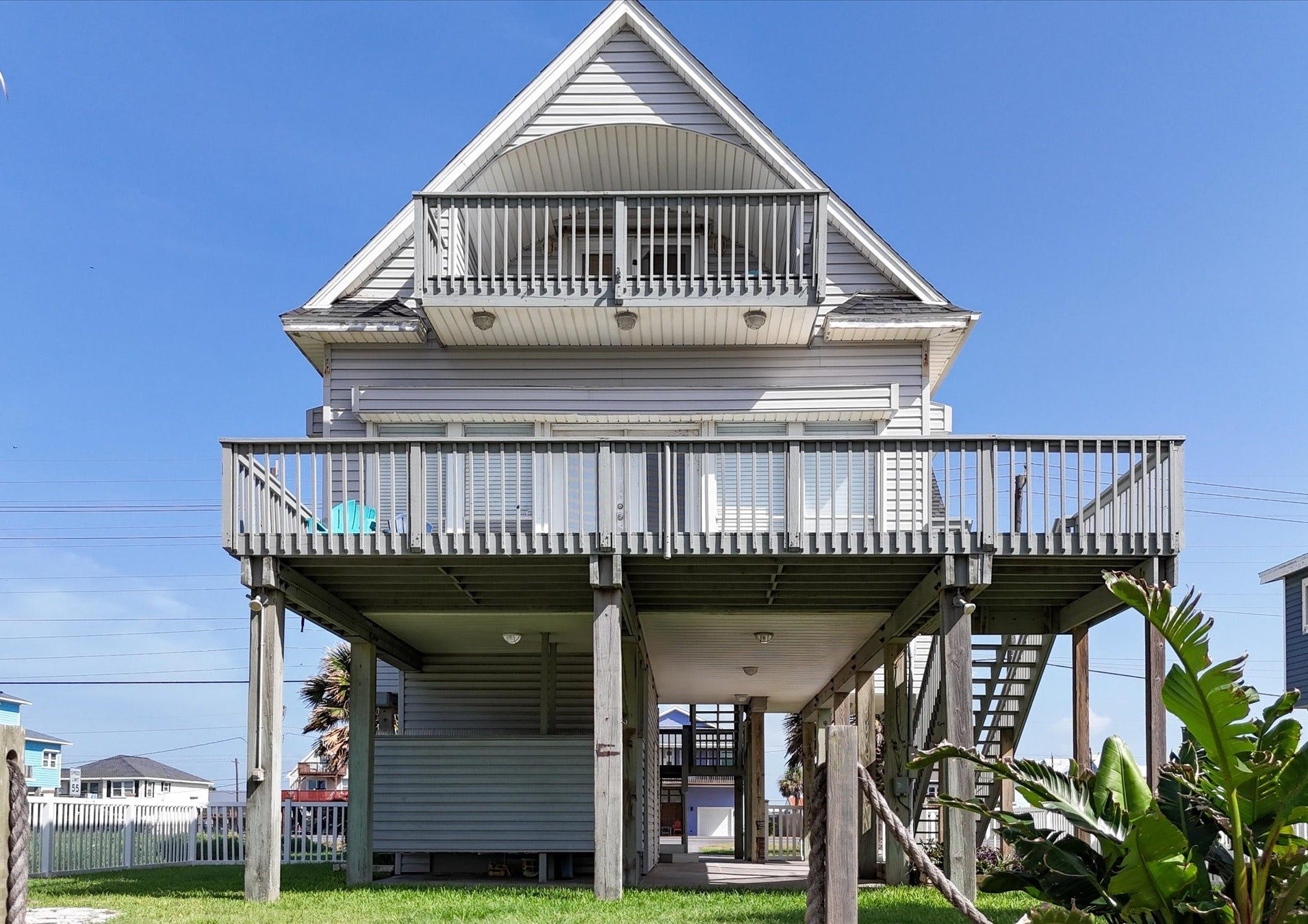 21519 San Luis Pass Road, Galveston, TX 77554 Elevated coastal home with two decks, providing ample outdoor space. The house features a stilt design, and is built high to deal with any potential flood but also to provide wonderful views. Perfect for enjoying seaside living.