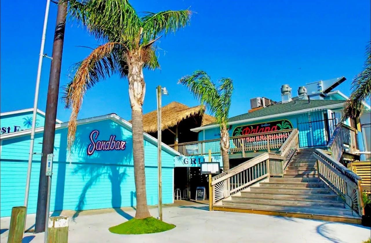 21519 San Luis Pass Road, Galveston, TX 77554 Discover vibrant waterfront dining at "The Restaurant at the Marina," where palm trees sway and coastal charm invites you to savor island-inspired flavors in a bright, relaxed atmosphere.
