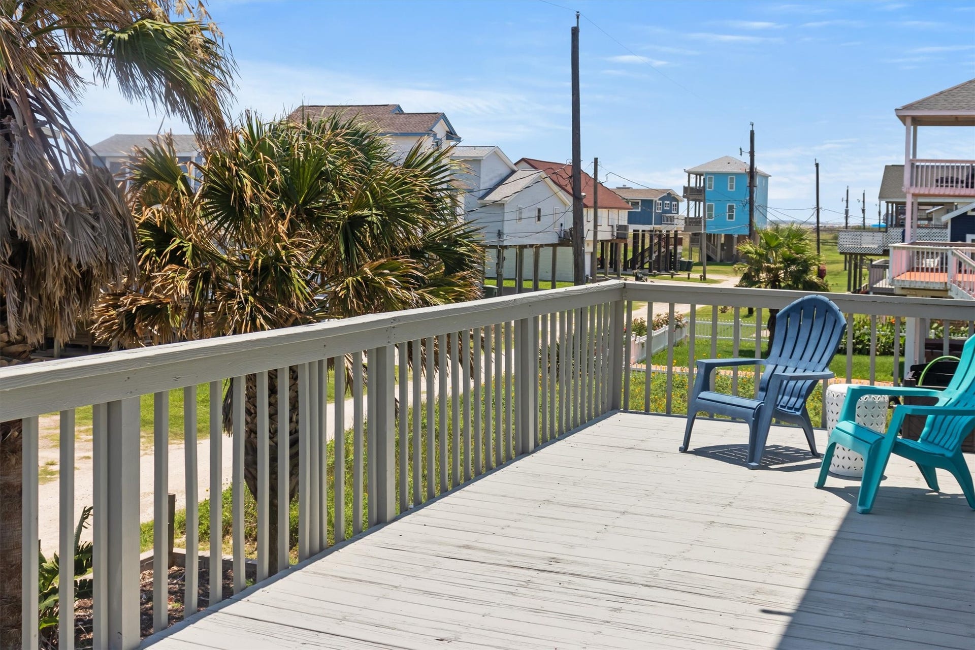 21519 San Luis Pass Road, Galveston, TX 77554 This photo showcases a spacious deck big enough for seating, offering a view of the nearby beach. The setting is perfect for enjoying outdoor relaxation and scenic surroundings.