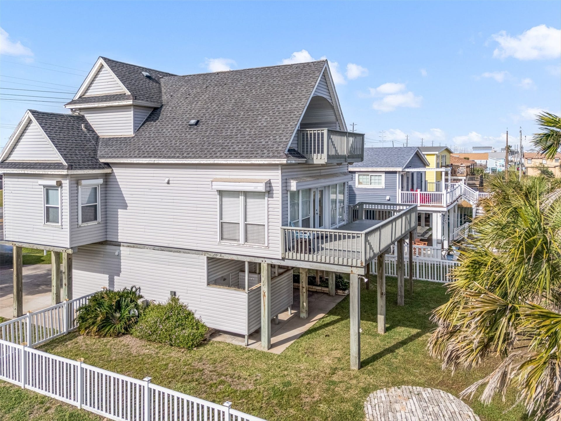 21519 San Luis Pass Road, Galveston, TX 77554 Be ready to enjoy the decks and covered patio below by day and the available fire pit area by night!