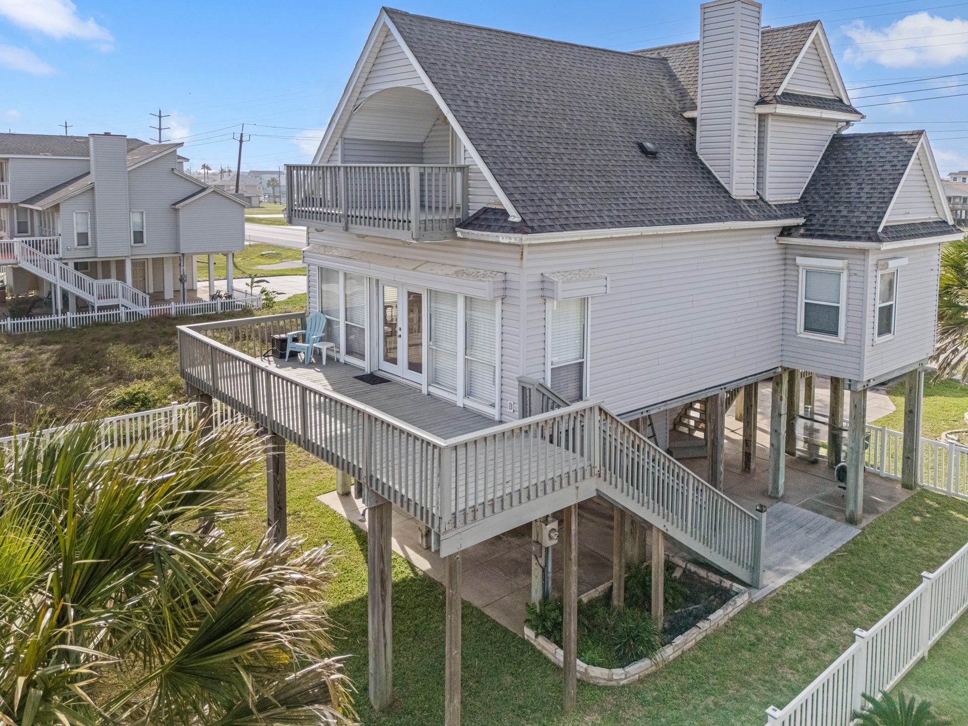 21519 San Luis Pass Road, Galveston, TX 77554 Note the two staircases, the storm shutters, two deck areas and the attractive design.