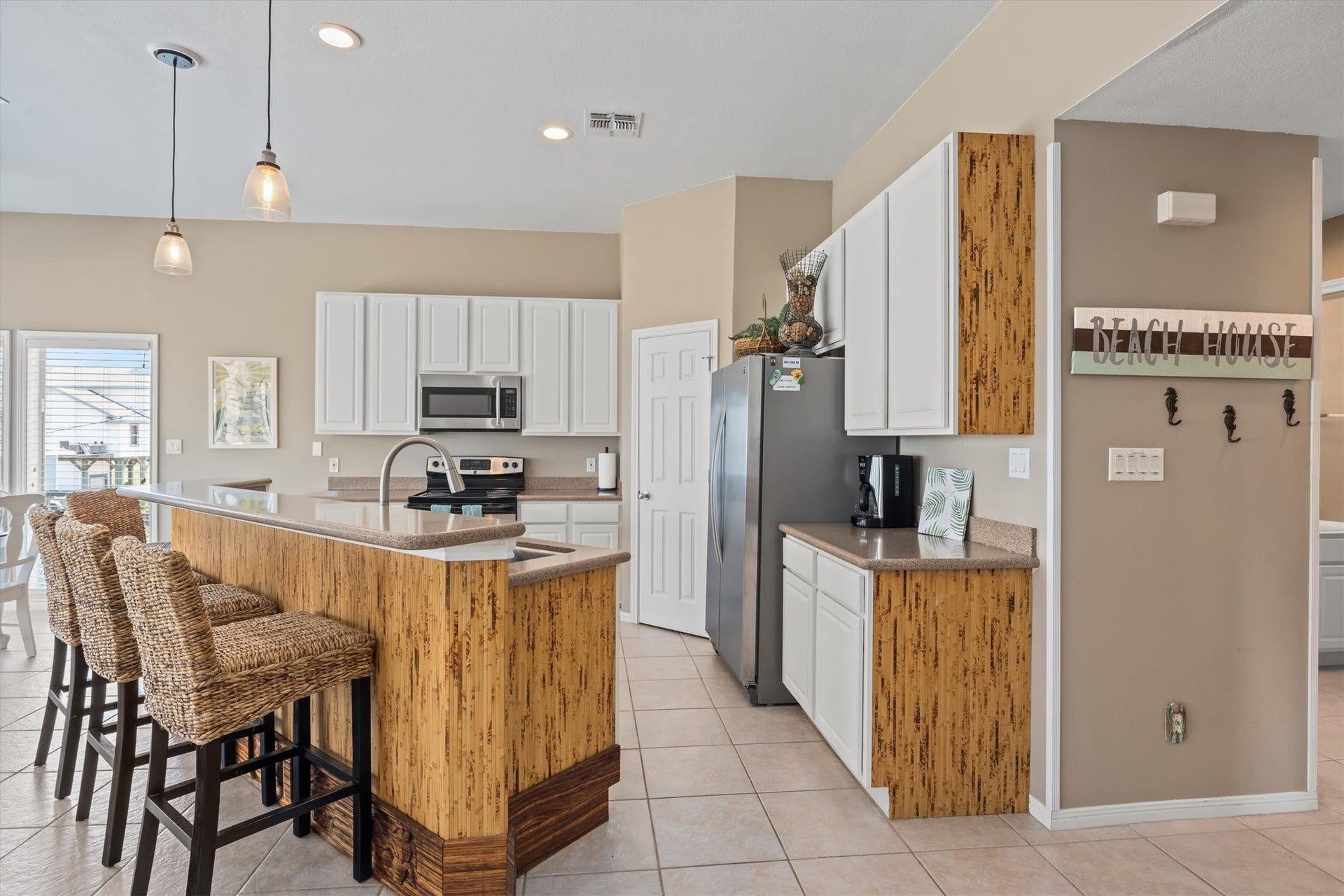 21519 San Luis Pass Road, Galveston, TX 77554 This inviting kitchen boasts abundant storage and expansive counter space, perfect for culinary adventures and entertaining guests.