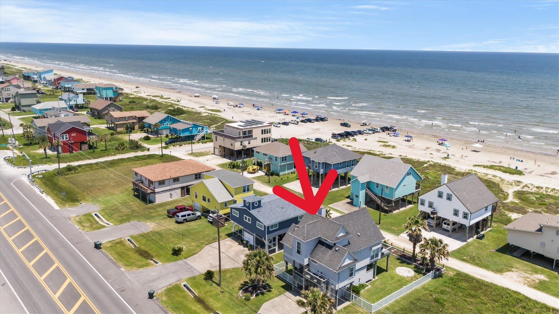 21519 San Luis Pass Road, Galveston, TX 77554 This coastal property offers stunning beach views and immediate access to the shore. The home is part of a charming neighborhood with colorful houses and is perfect for enjoying seaside living.