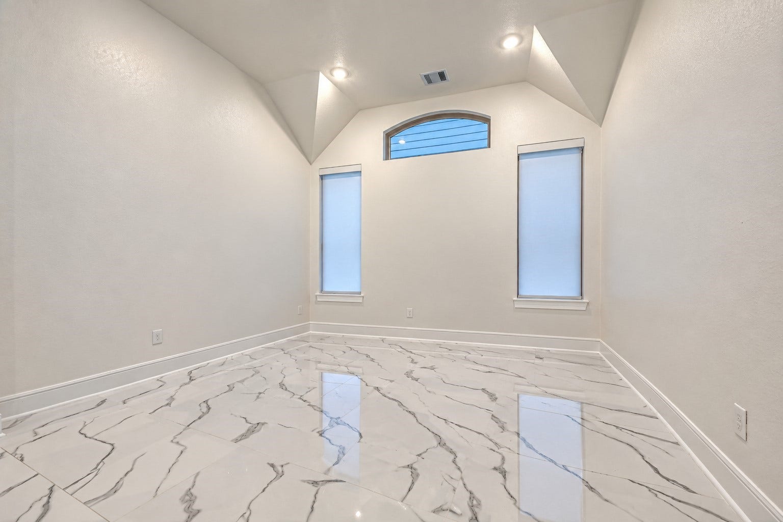 12215 Mackinchan Street, Richmond, TX 77407 An elegant dining room designed for memorable family gatherings and sophisticated entertaining, offering a welcoming setting to celebrate special occasions and create lasting memorie