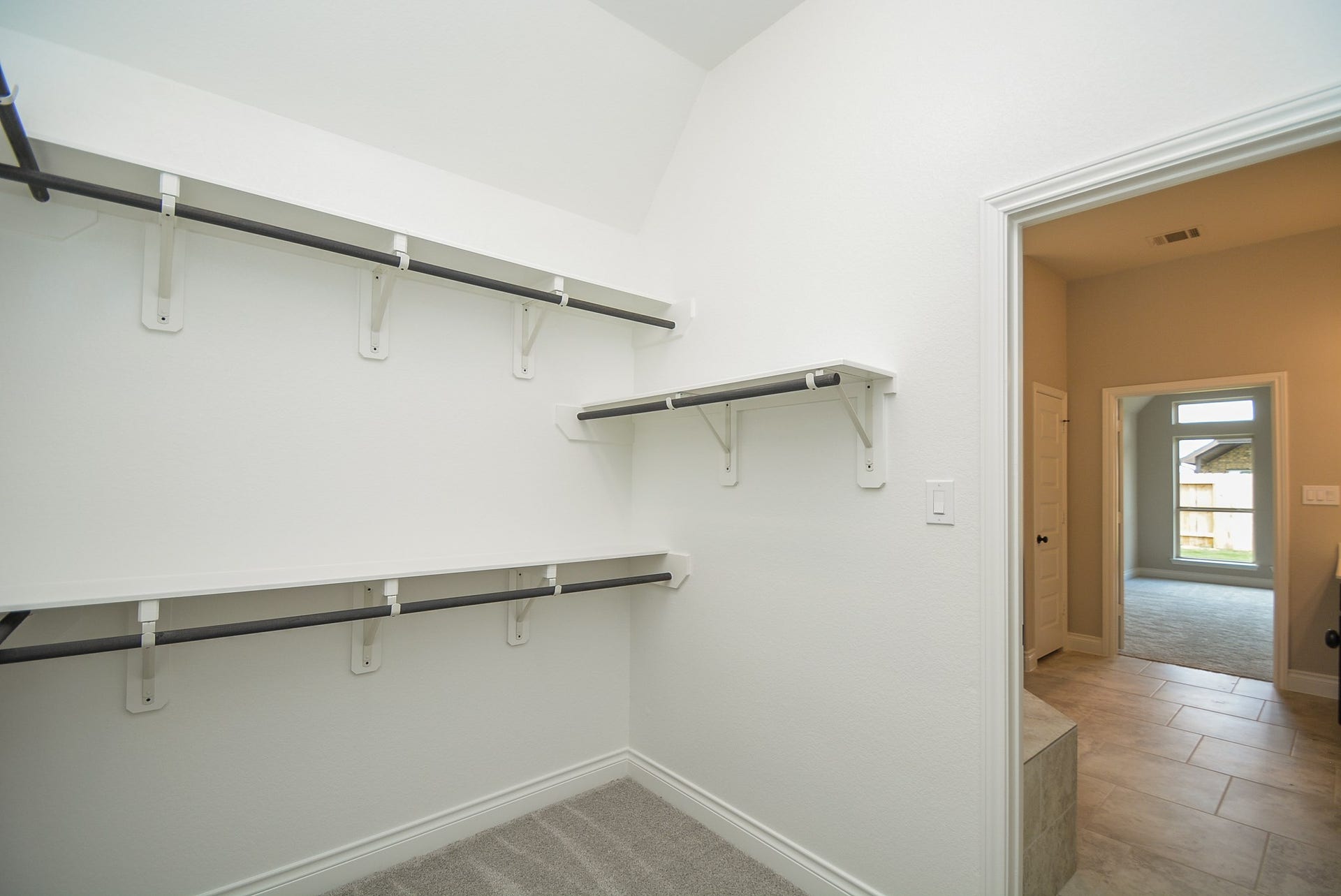 Primary master bedroom walk-in closet