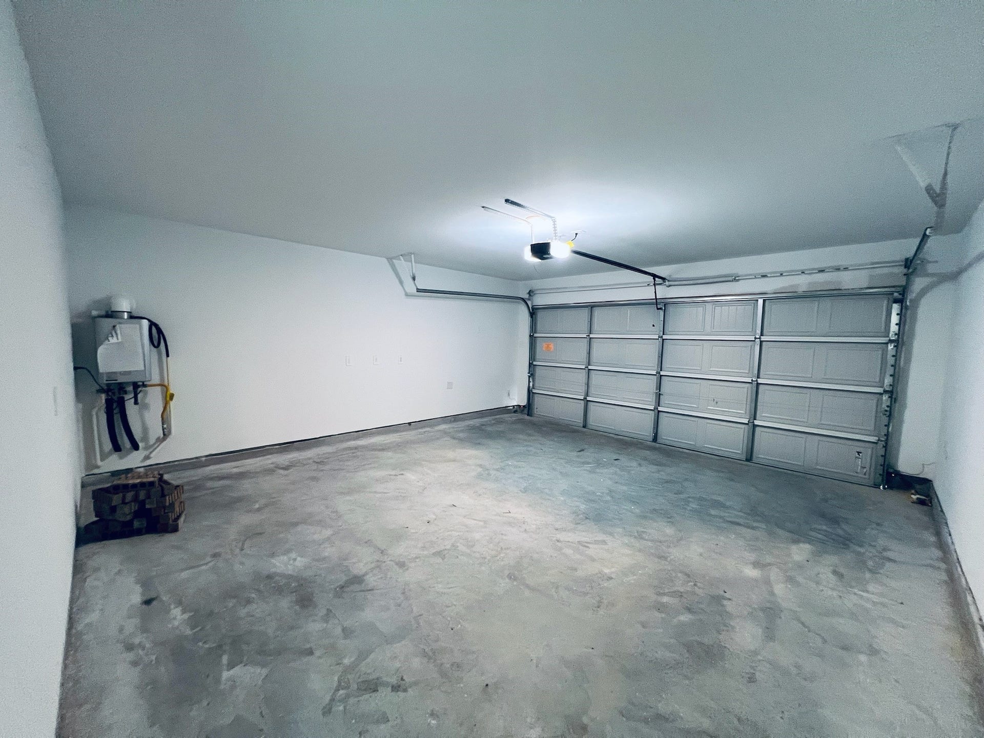 3011 Mallorca Drive, Conroe, TX 77301 Garage includes remote garage door opener and tankless water heater