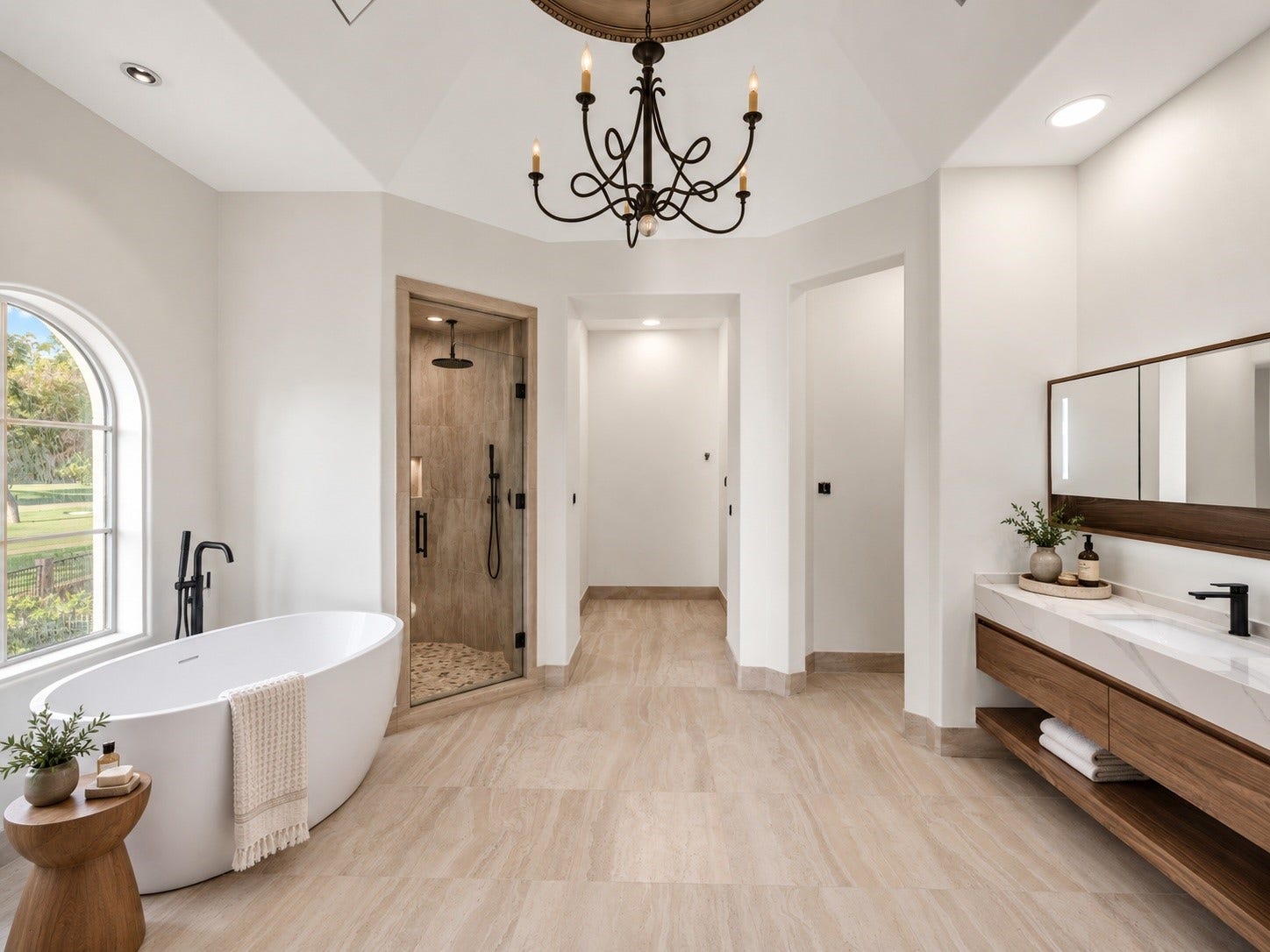 23 Beacon Hill Hill, Sugar Land, TX 77479 A light-filled bathroom features a freestanding soaking tub, refined cabinetry, elegant fixtures, and thoughtfully appointed finishes, offering a private and comfortable experience for guests or family.