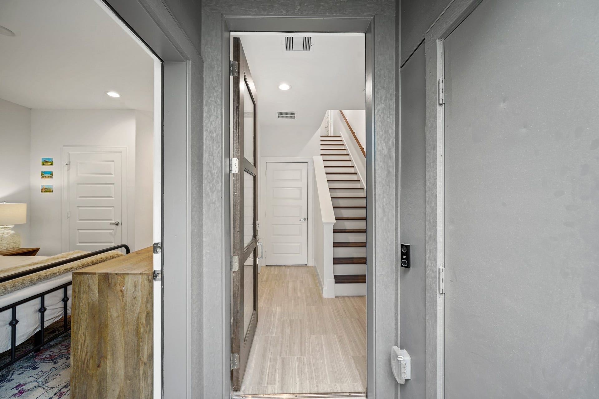 2709 Clinton Drive, Houston, TX 77020 Doors; exterior door for bedroom 1(left), front entrance door, garage entrance door(in back), package delivery door on right (grey)