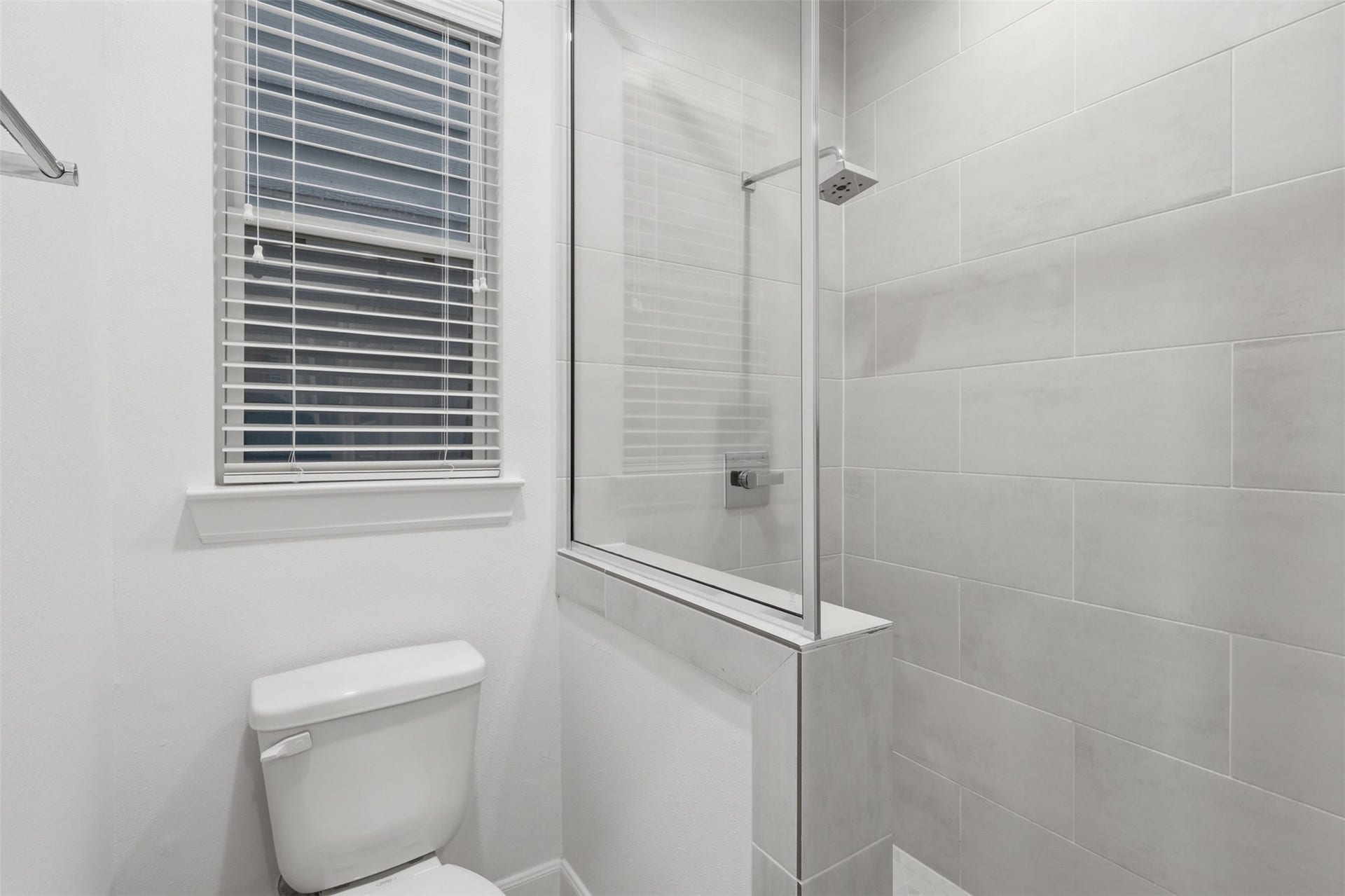 2709 Clinton Drive, Houston, TX 77020 Bedroom 1: toilet and spacious high ceiling shower