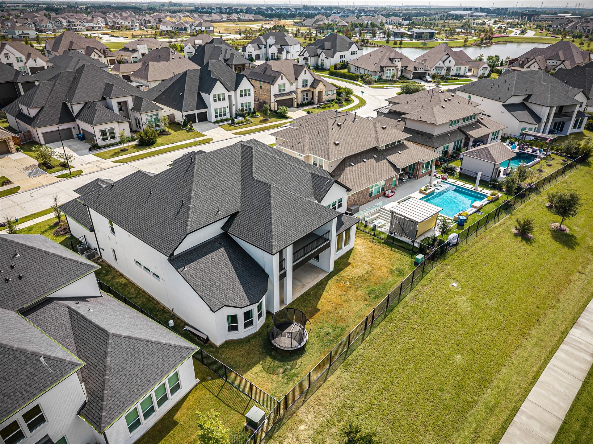 A generously sized backyard overlooking the water, ideal for creating your dream pool oasis