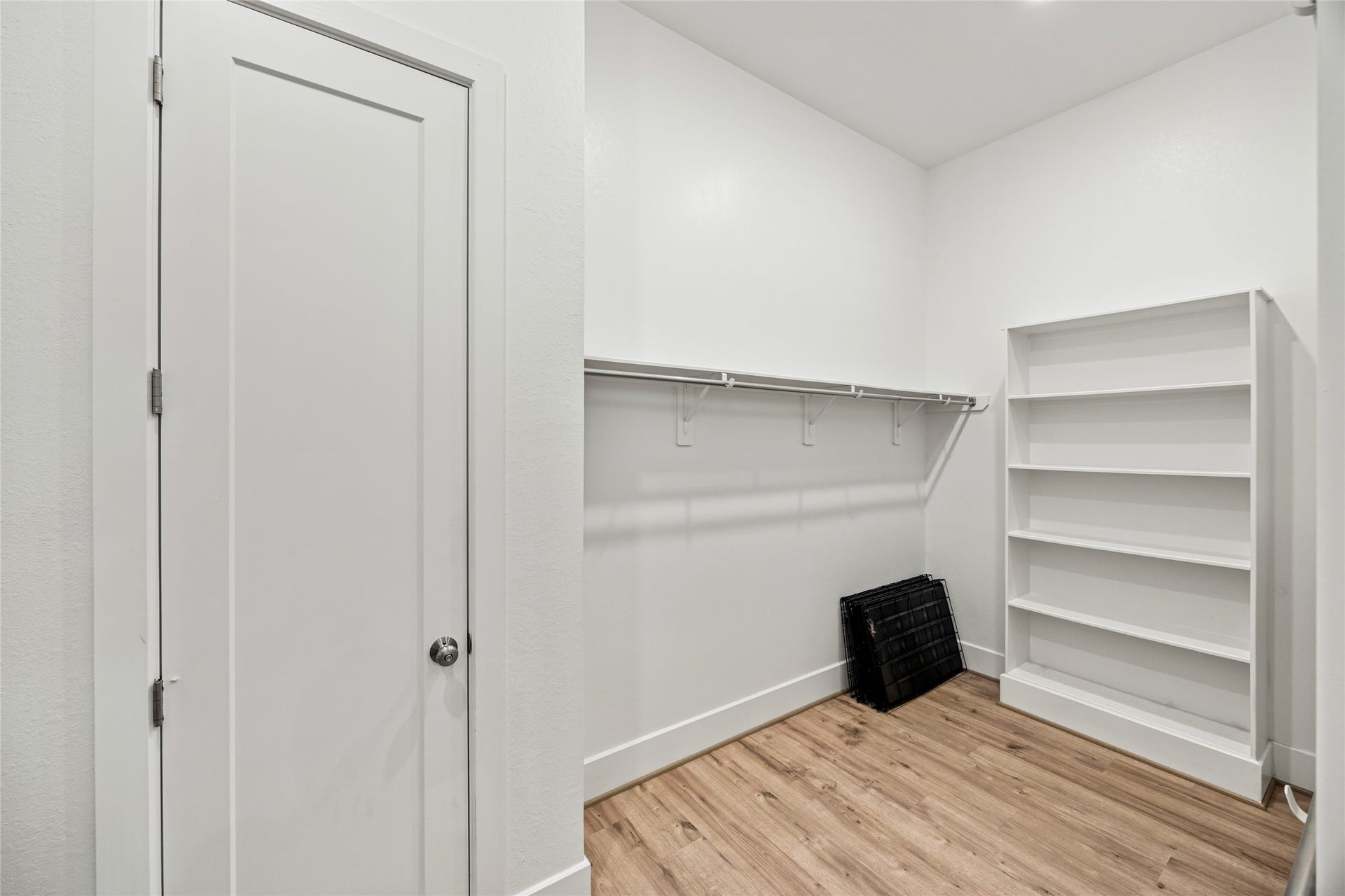 Two separate his-and-hers closets provide ample storage and organization