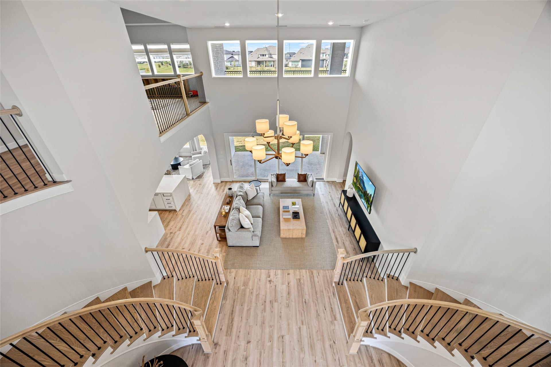 Looking down from upstairs offers a grand, open perspective of the home