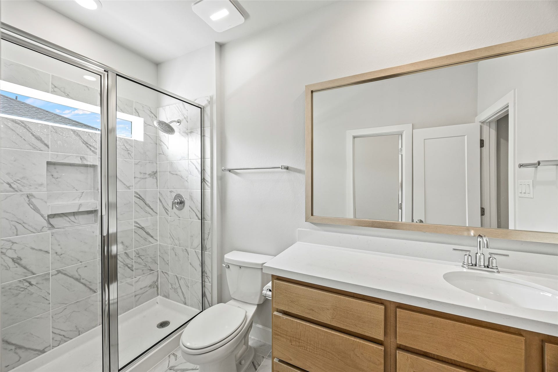 Elegant marble showers add a touch of luxury to the bathrooms