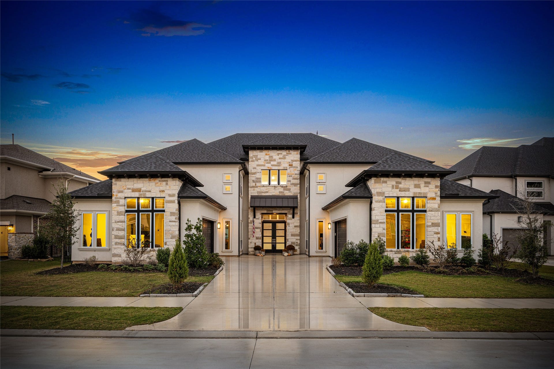 The stunning front elevation showcases timeless curb appeal and elegant design