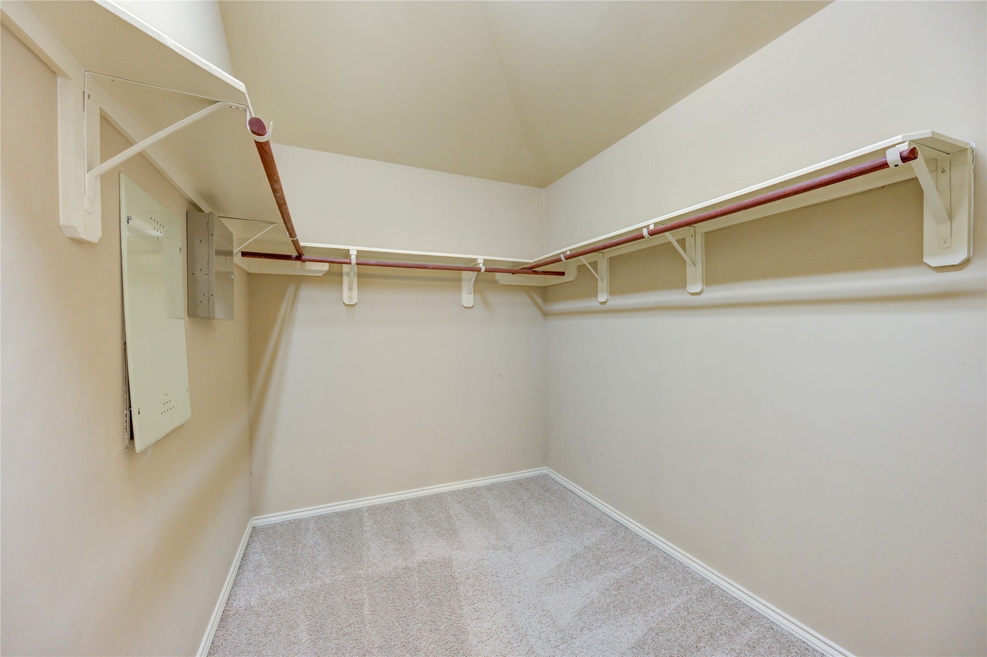 walk in closet in primary bedroom