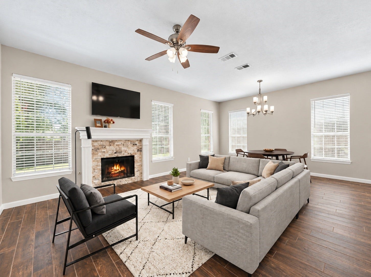 Step inside to a bright, inviting living space where fresh finishes, natural light, and a striking fireplace create the perfect setting for everyday living. Virtually staged.