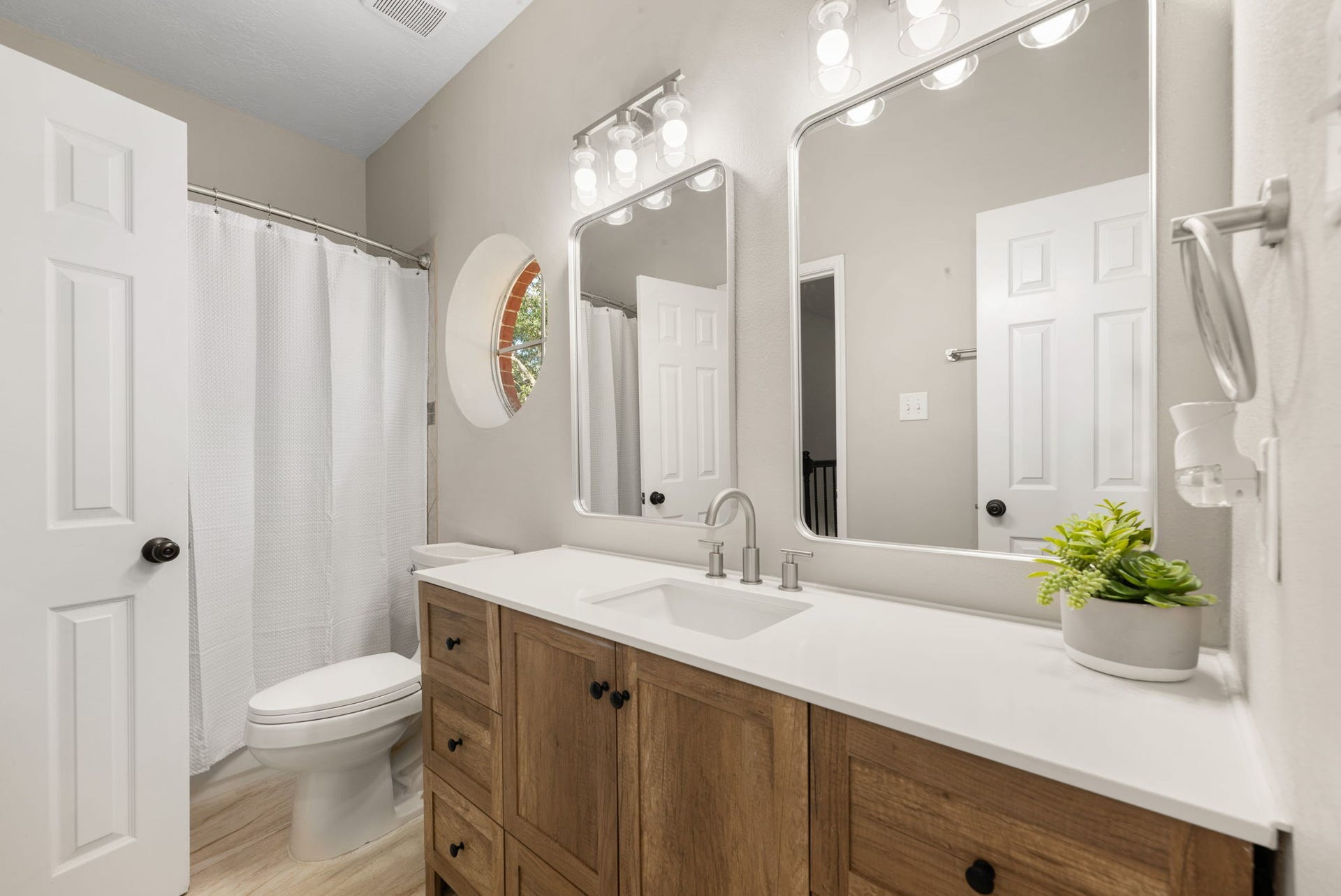 The upstairs secondary bathroom features a spacious vanity and convenient tub/shower combination, serving the additional bedrooms.