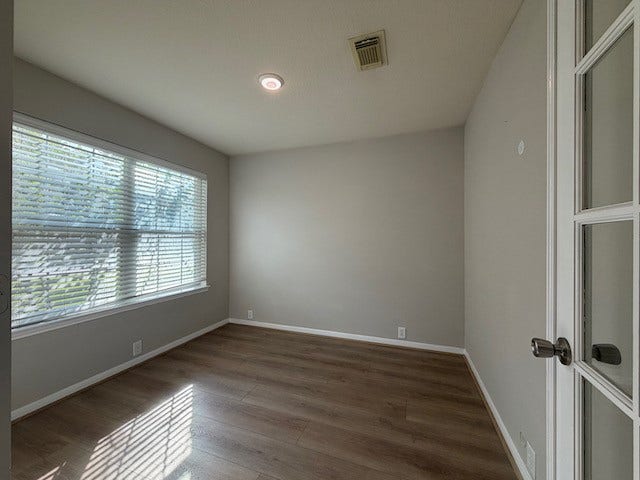 20023 Cypresswood Glen, Spring, TX 77373 Private home office with French doors enjoys views of the front yard.