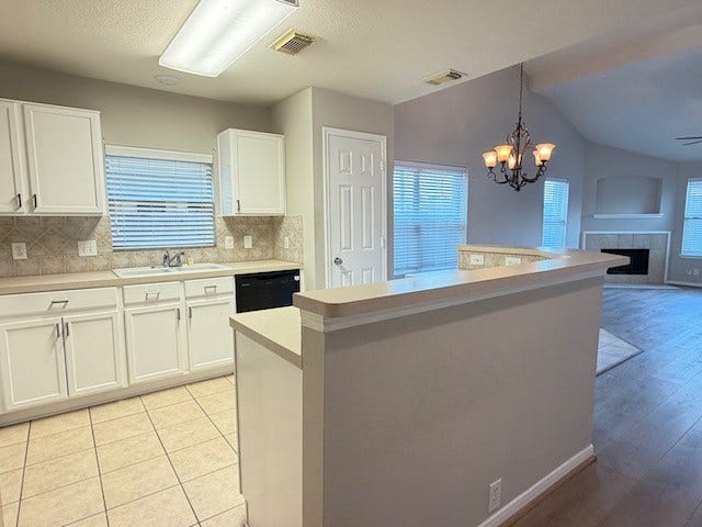 20023 Cypresswood Glen, Spring, TX 77373 Cheery kitchen with white cabinets and a LOT of them!