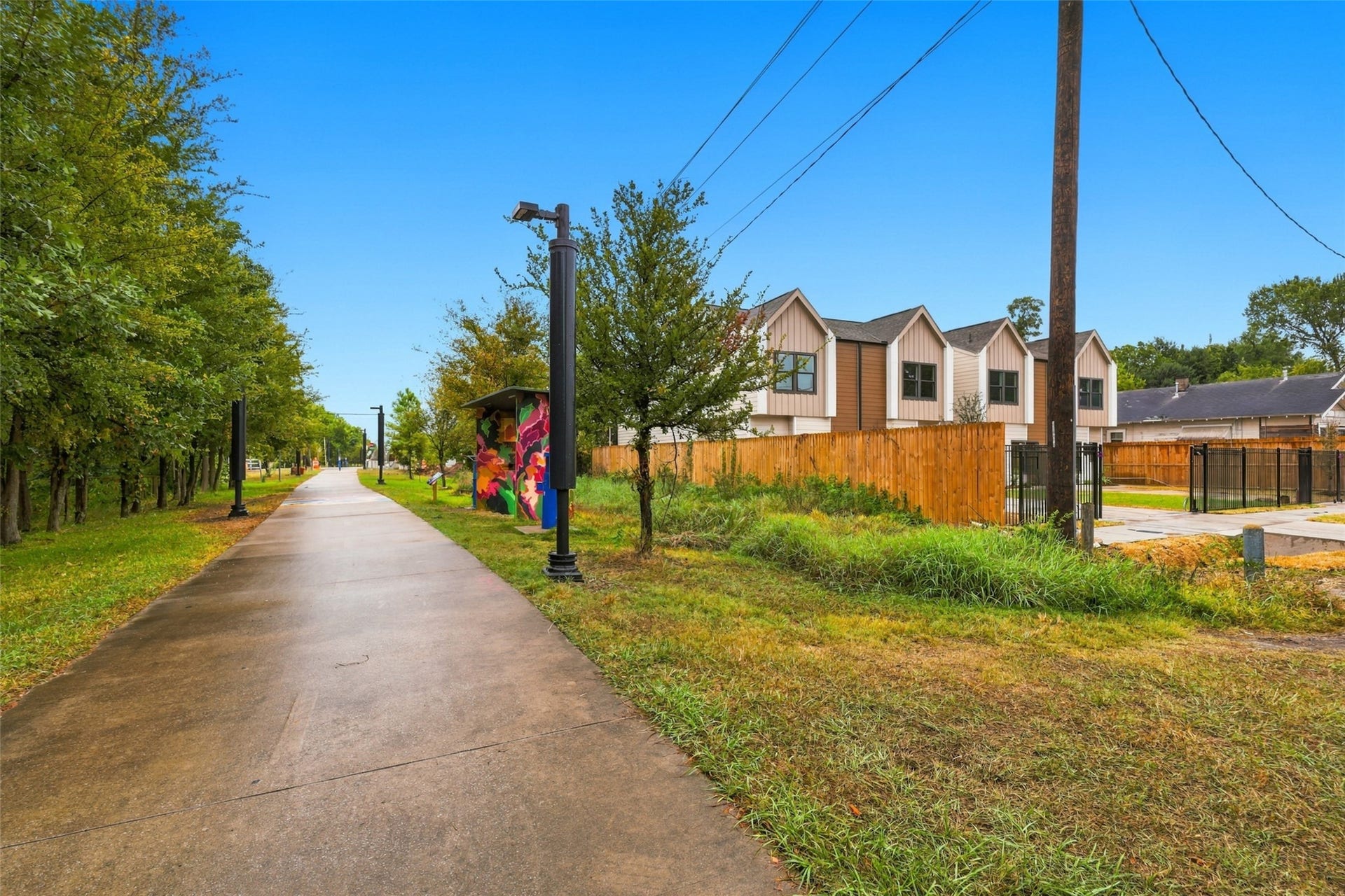 3201 & 3205 Berry Street, #A/B, Houston, TX 77004 Charming area with modern homes adjacent to a scenic walking path- The Columbia Tap- lined with trees and vibrant street art.