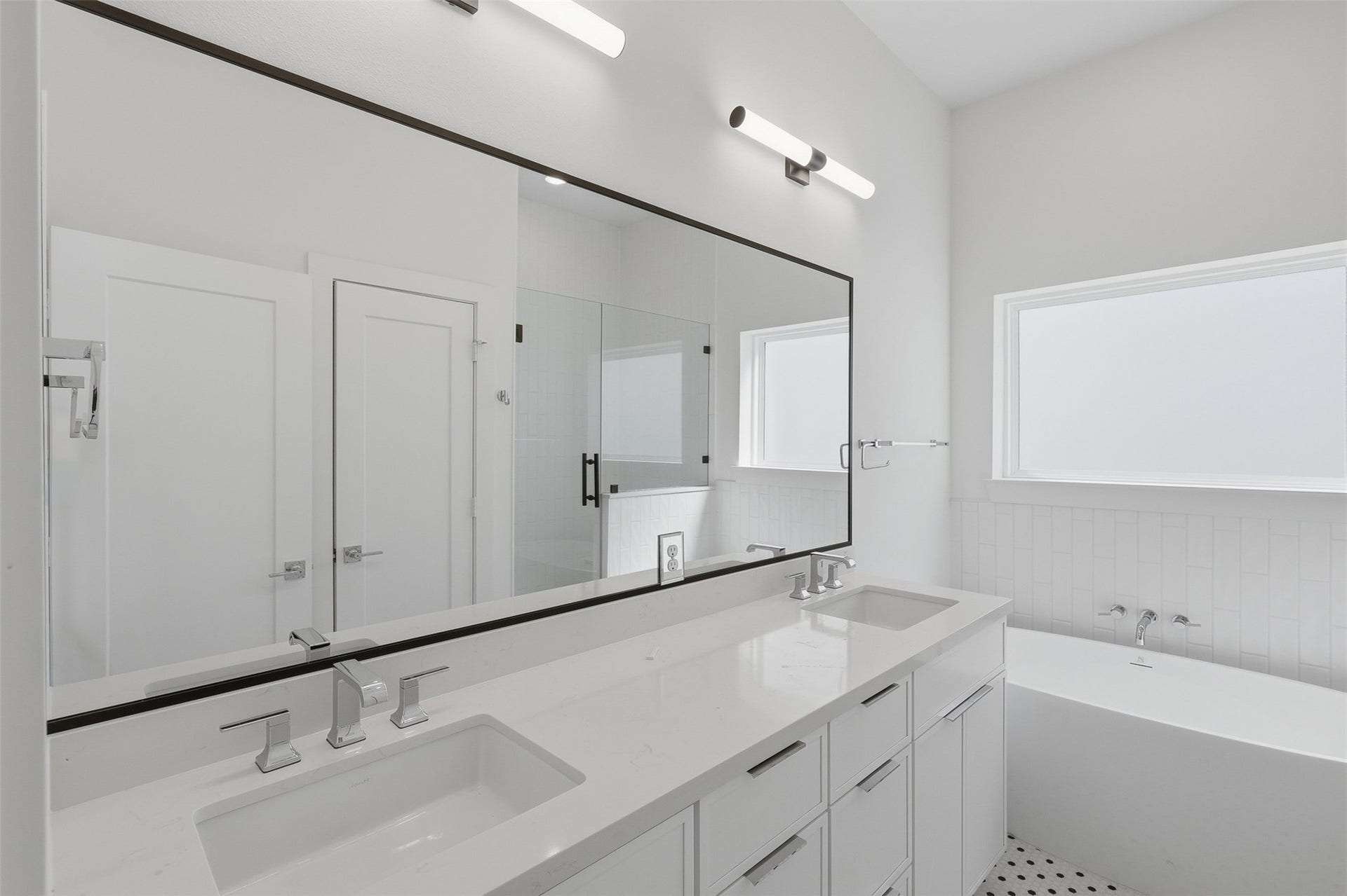 The double vanity provides separate sinks and storage below.
