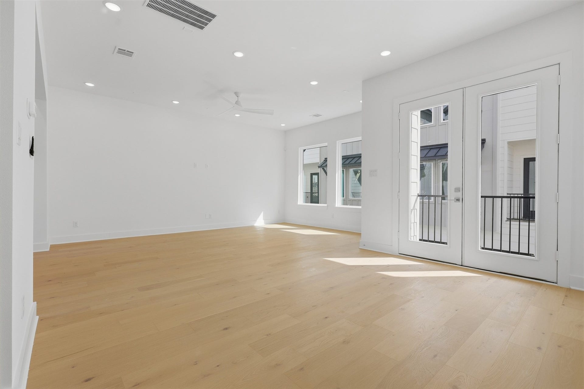 From the living area, a door opens onto the covered balcony.