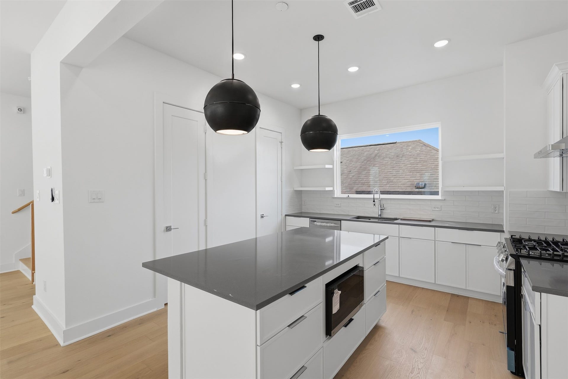 The kitchen island gives you a place to prepare meals, pull up a seat, and stay part of the conversation.