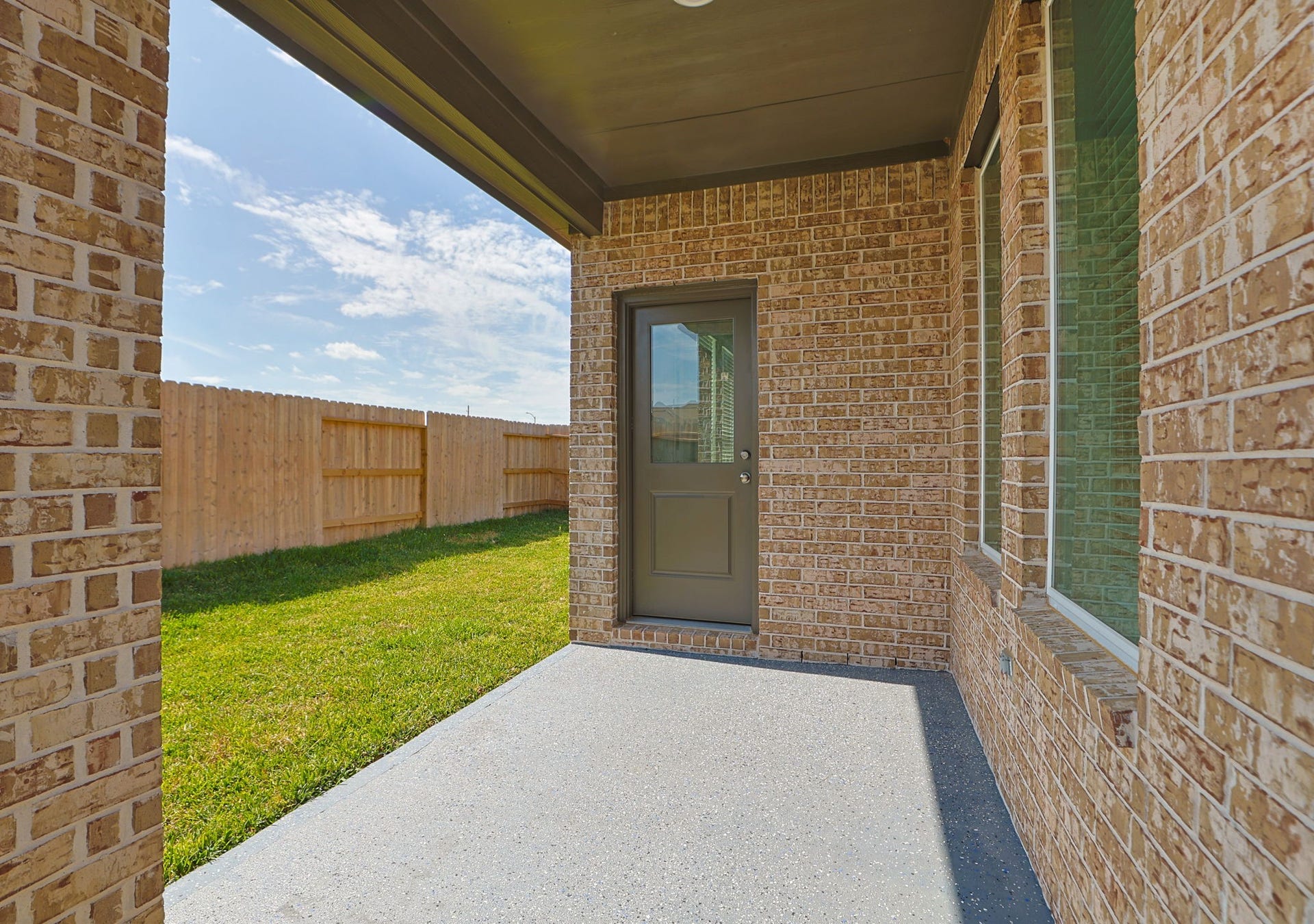 29039 Bison Haven Drive, Hockley, TX 77447 Covered back patio looking onto backyard.
