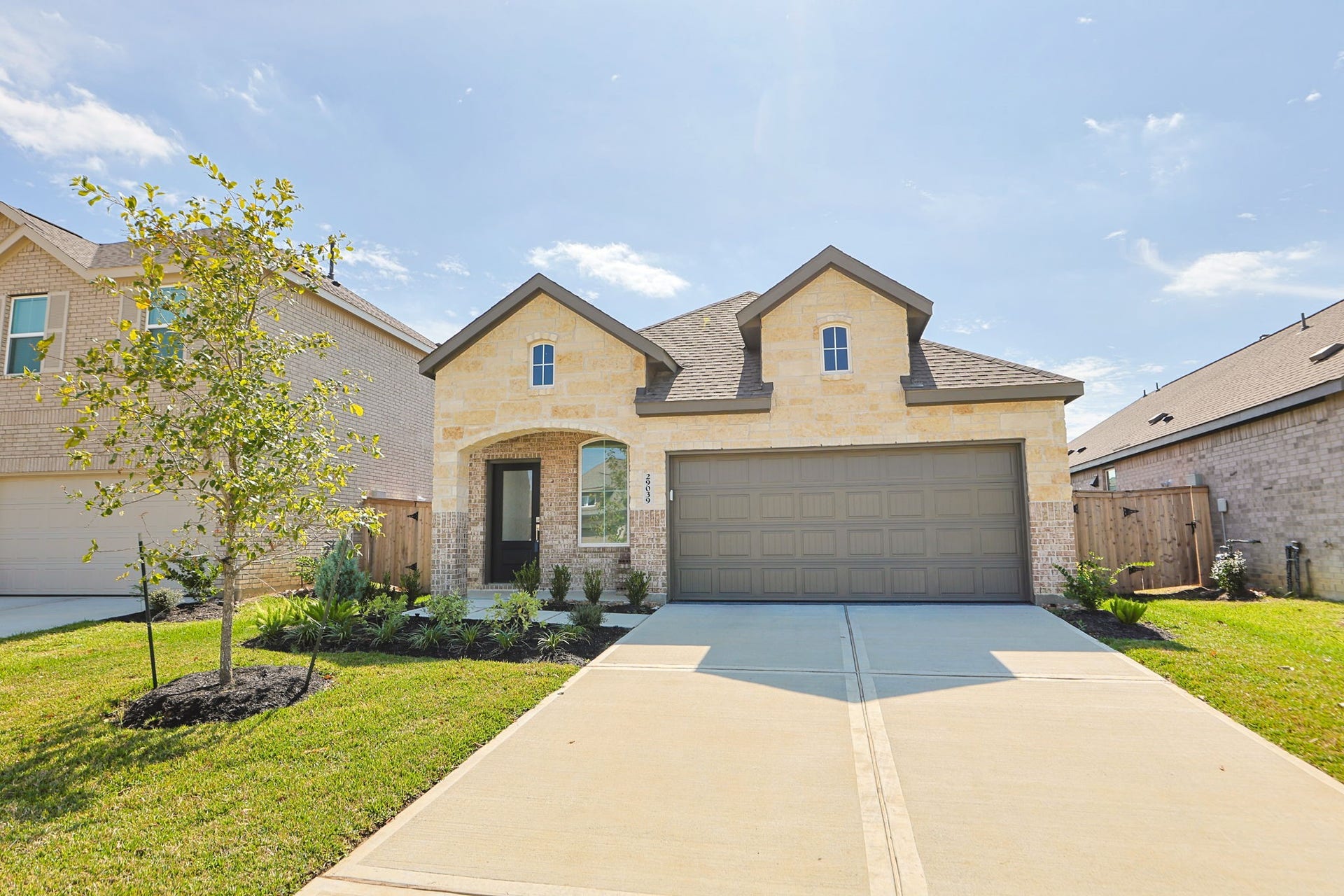 29039 Bison Haven Drive, Hockley, TX 77447 The home has attractive flower beds.