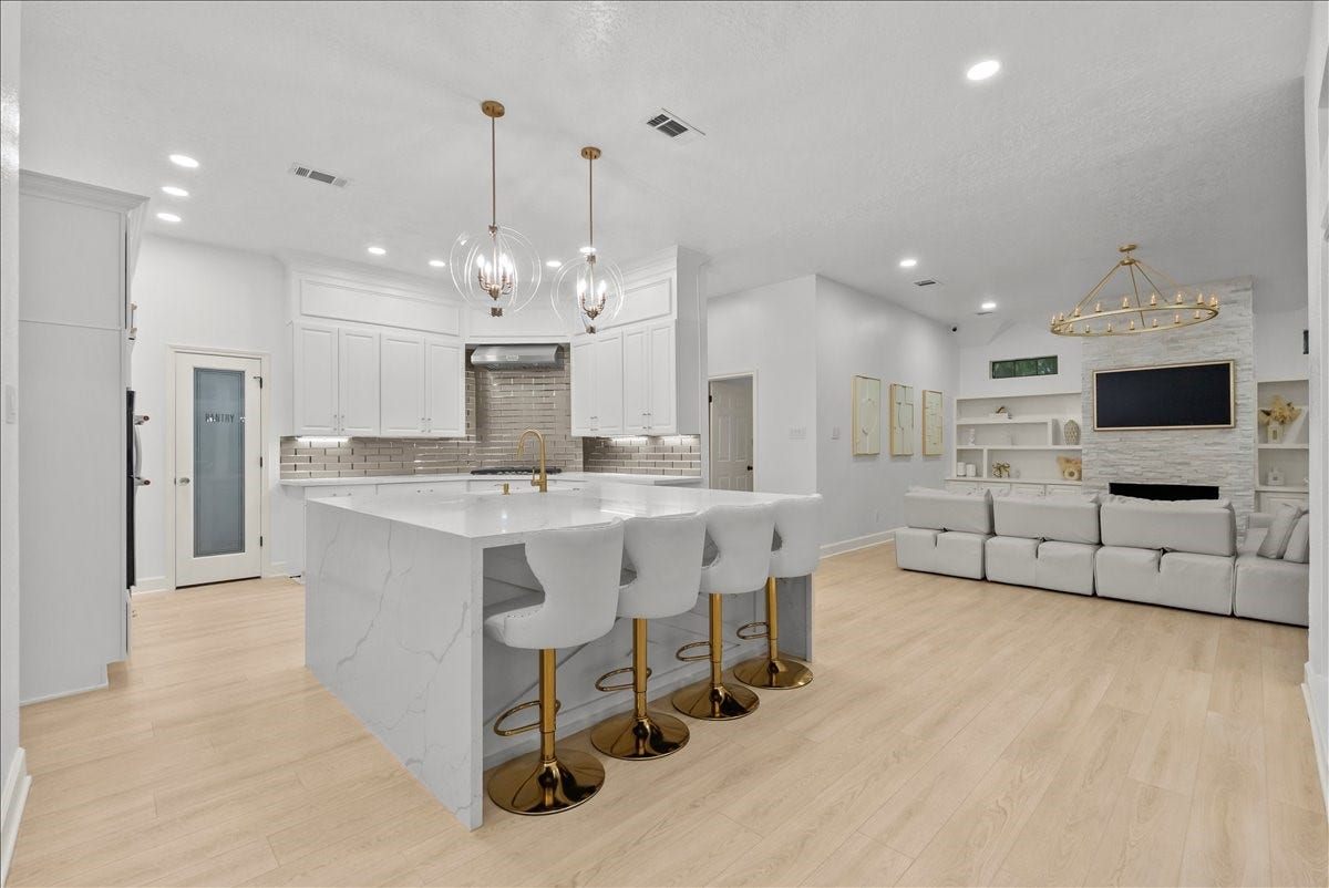 9700 Jay Road, Hitchcock, TX 77563 The heart of the home is nothing short of spectacular. This designer kitchen combines timeless elegance with everyday functionality, creating a space that's destined to become everyone's favorite gathering place.