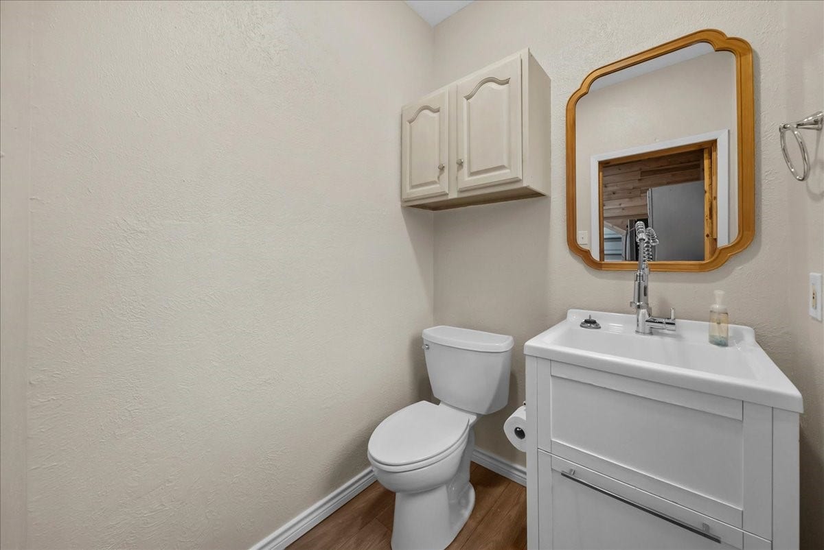 9700 Jay Road, Hitchcock, TX 77563 The garage includes a conveniently located half bath, offering added comfort and functionality for this exceptional space.