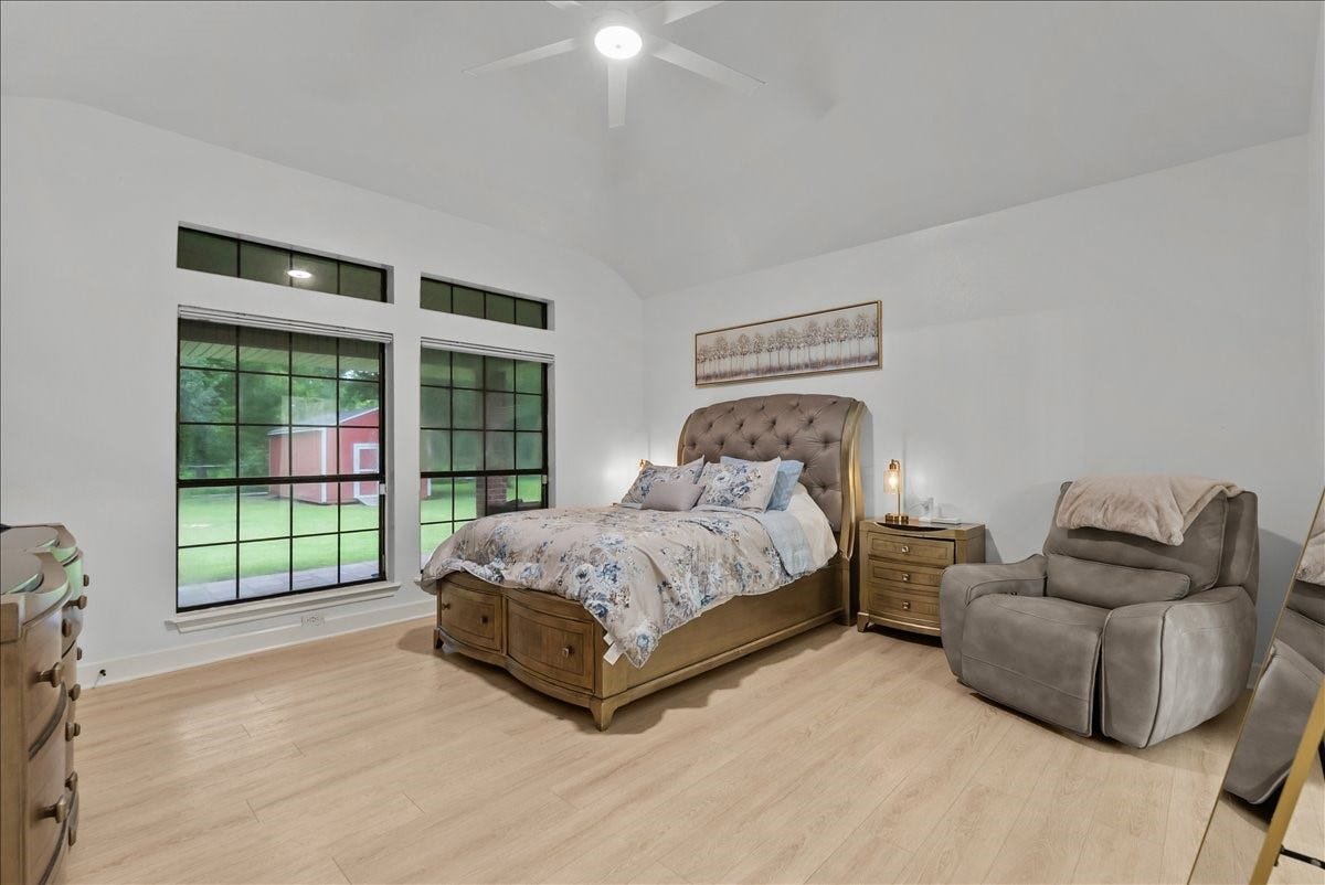 9700 Jay Road, Hitchcock, TX 77563 Designed for relaxation, this generously sized primary bedroom offers a peaceful escape with plenty of space for a sitting area, oversized furnishings, and your own private sanctuary.