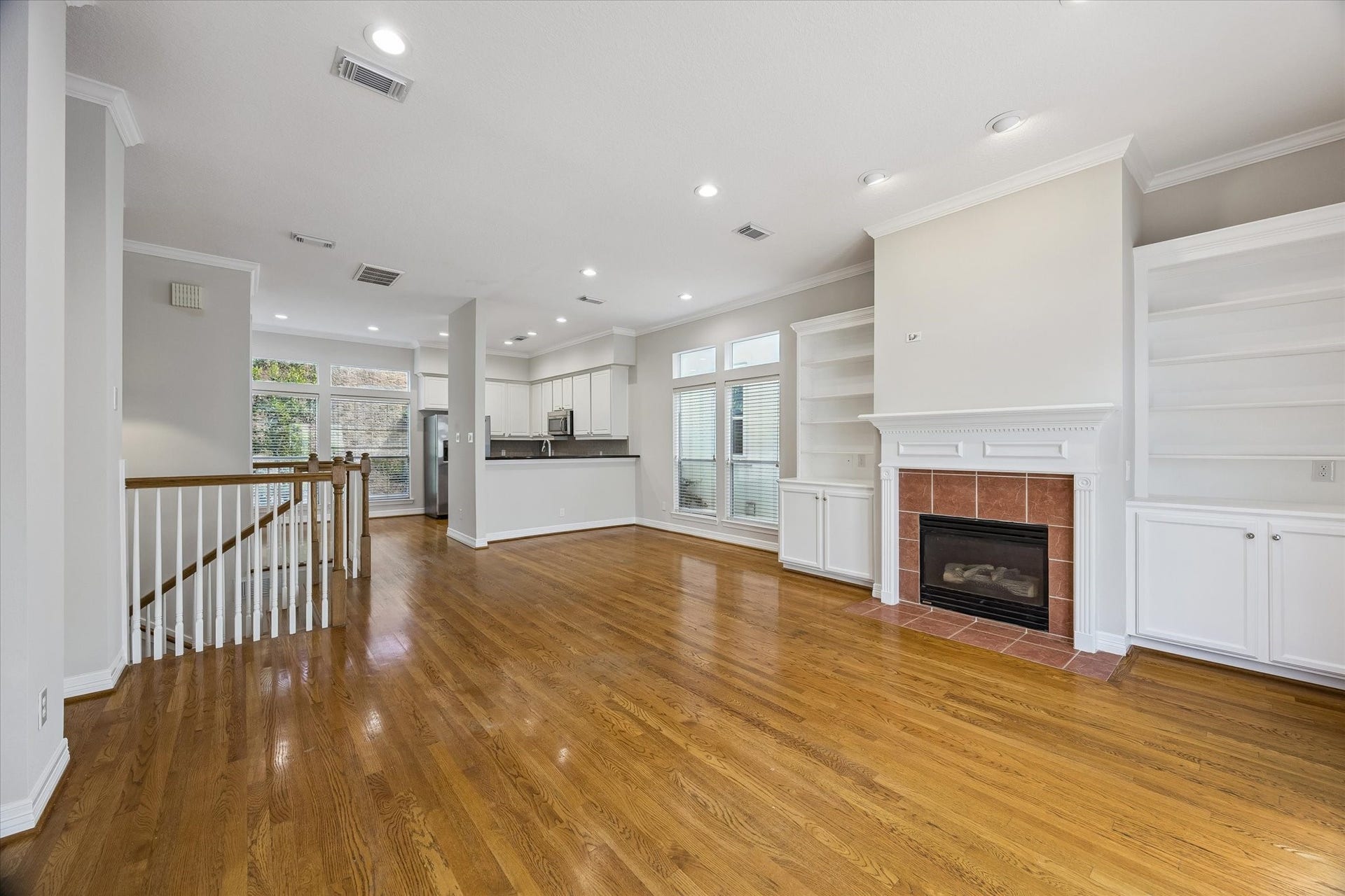 Another view of the OPEN LIVING FLOOR! Original hardwood floors unify the space!