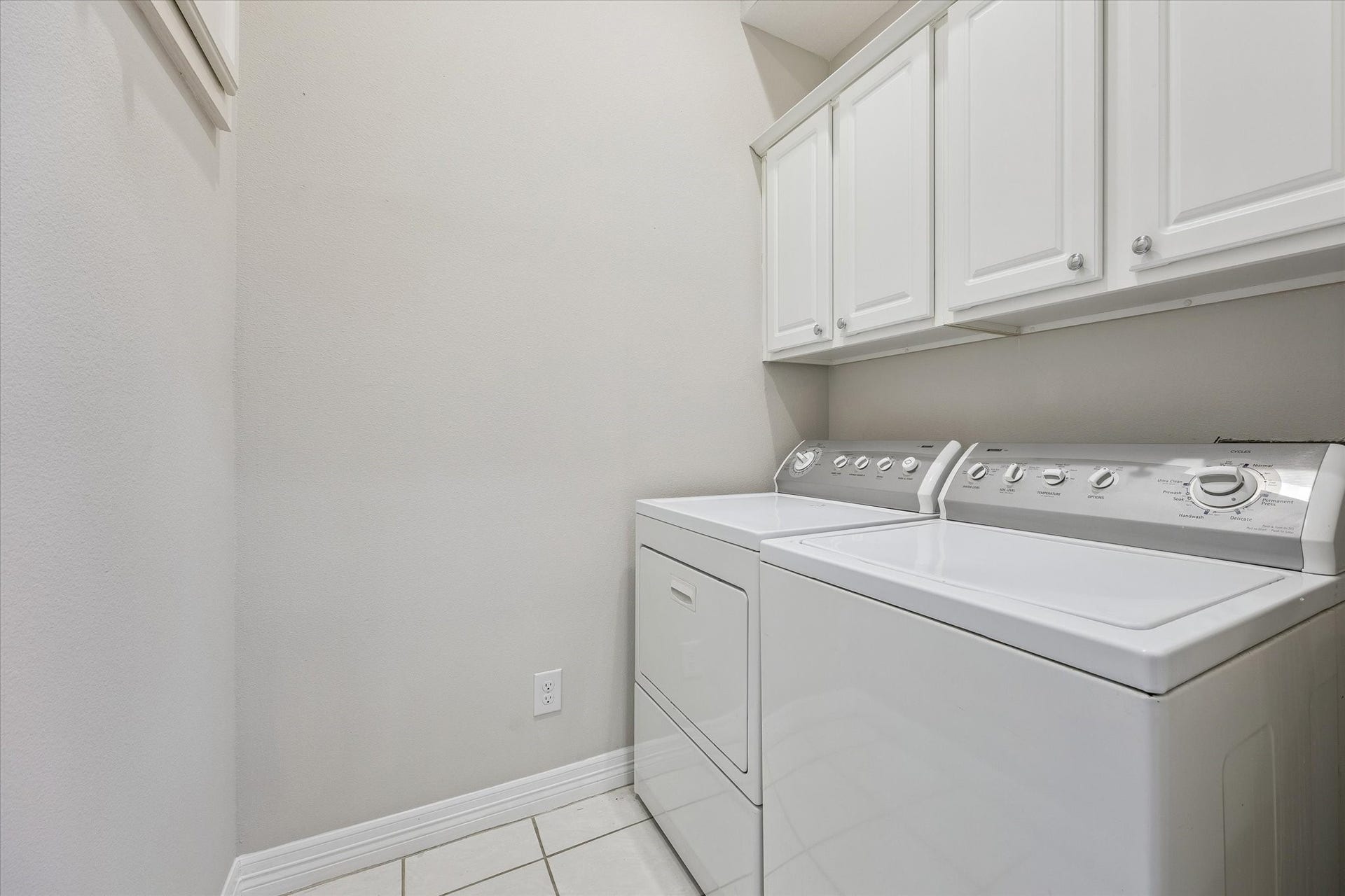 Laundry room offers plenty of space for additional utility storage PLUS extra deep cabinets "in the wall"! This home utilizes all extra corners for PLENTY of storage!